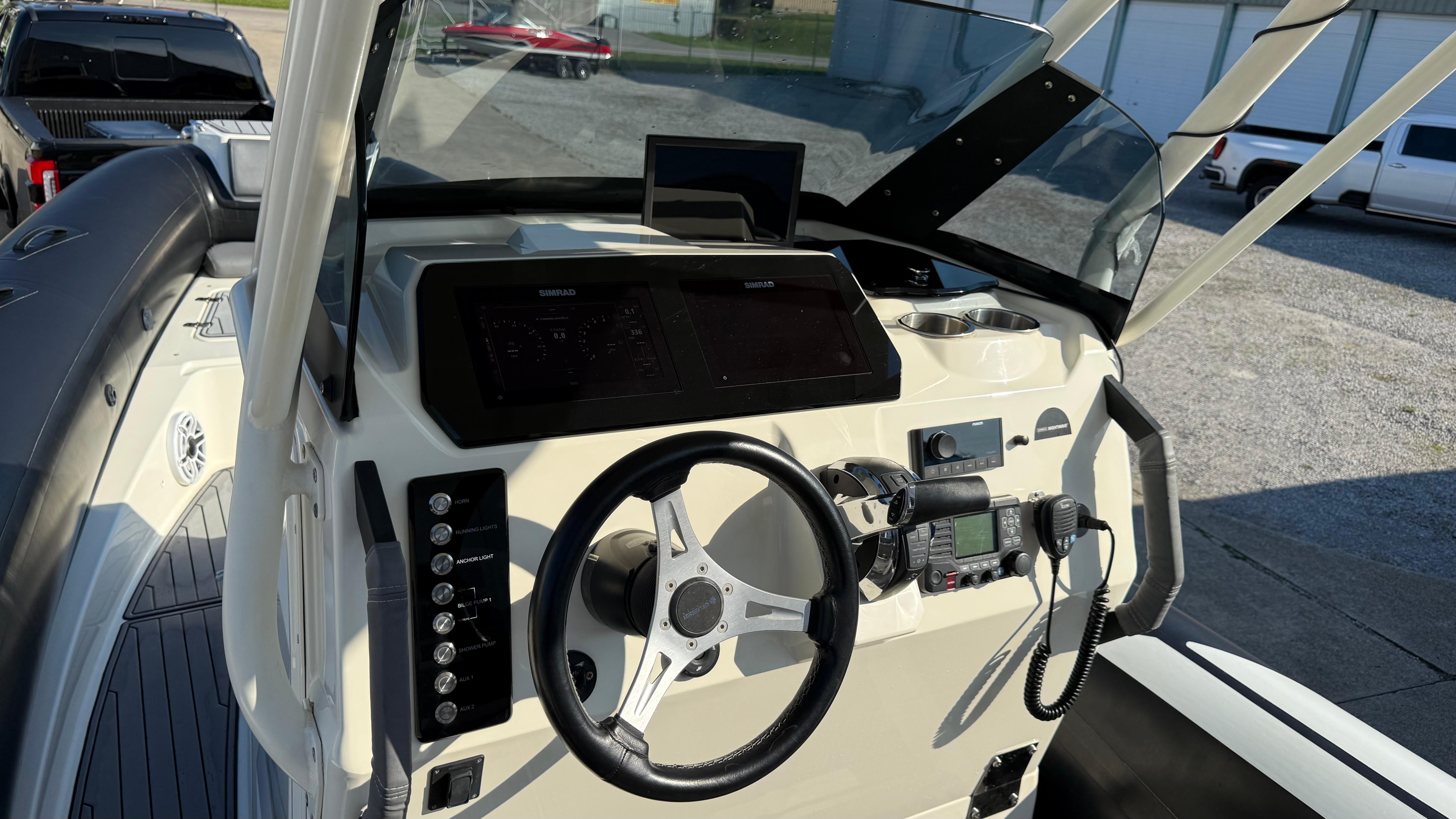 2022 Brig Eagle 8 boat dashboard with steering wheel and navigation controls.
