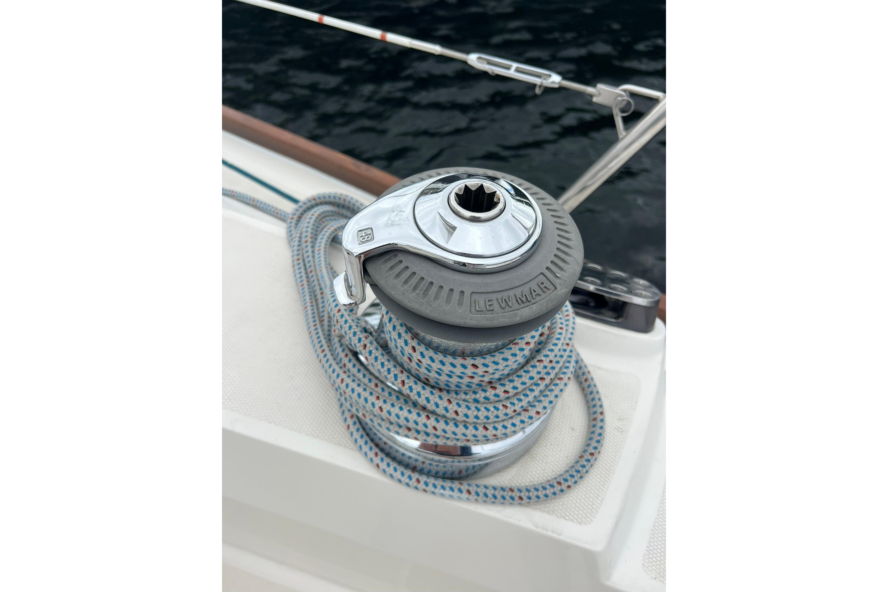 Winch with rope on 1998 Sabre 362 sailboat deck, near water.