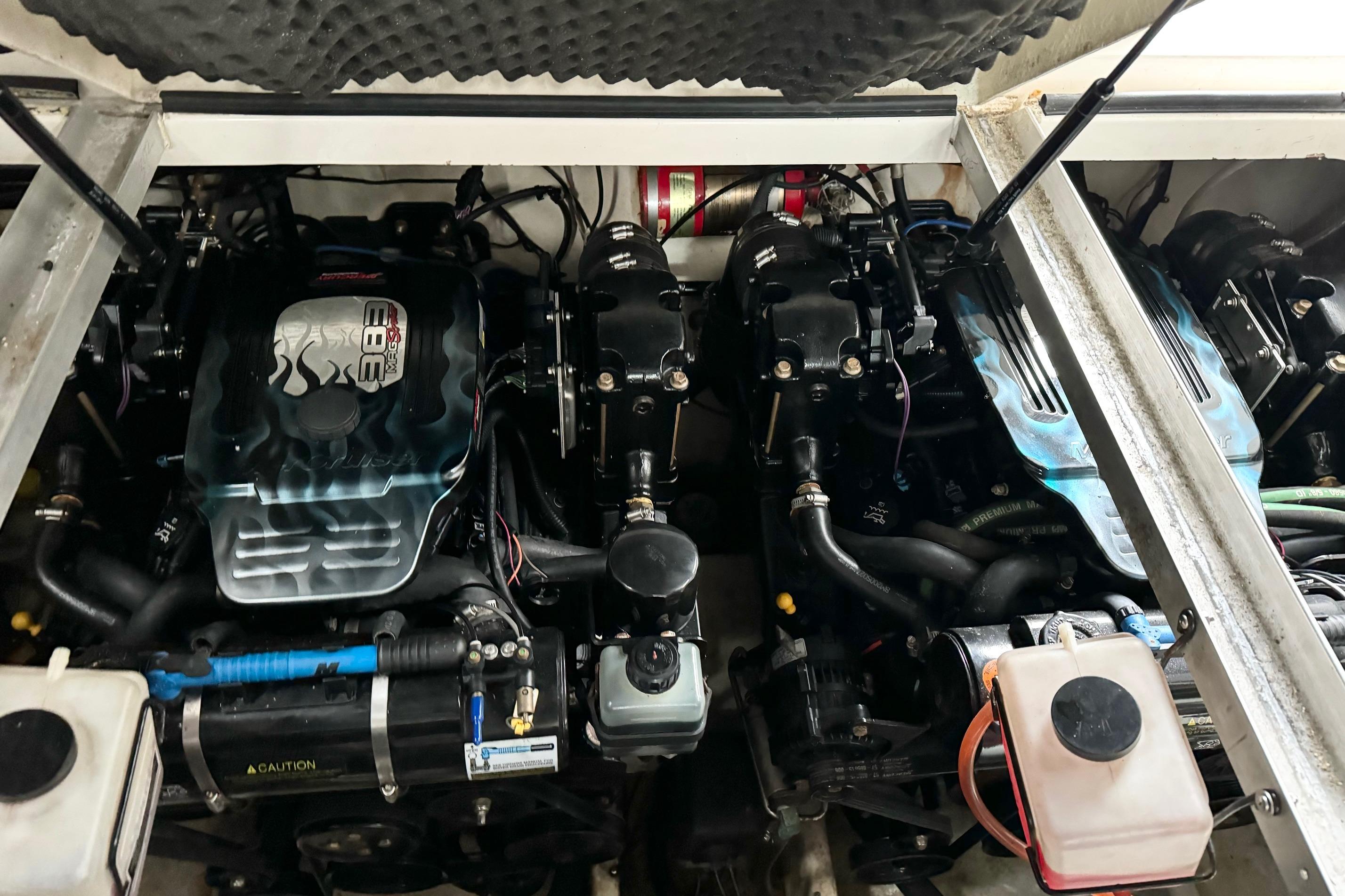 Engine compartment of a 2005 Monterey 302 Cruiser with dual engines and mechanical components.