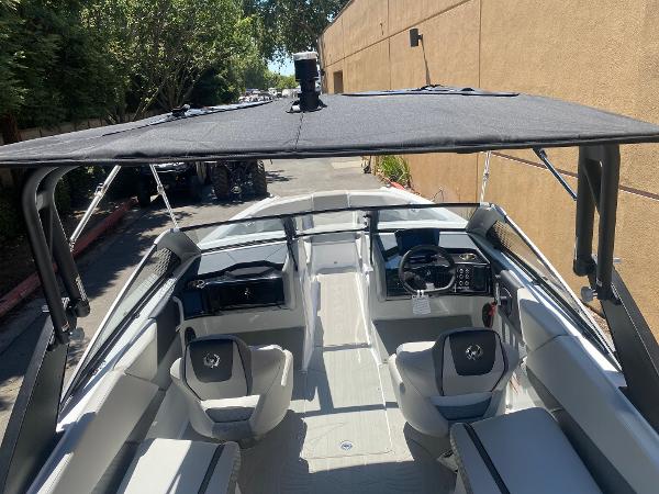 2025 Scarab 235 SE boat interior with sleek seating and modern dashboard.