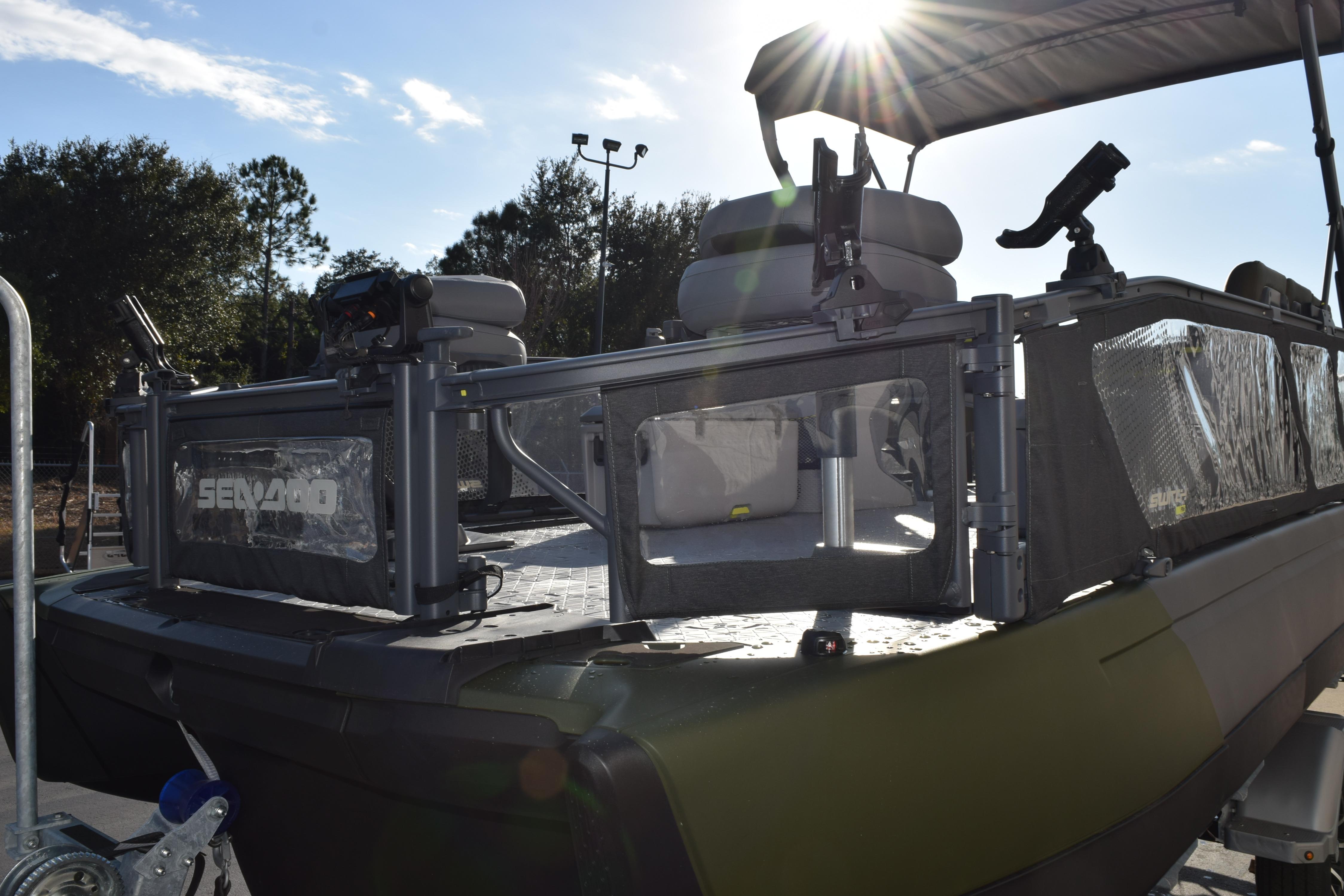 2026 Sea-Doo Switch Fish 21 pontoon boat with fishing setup in sunlight.