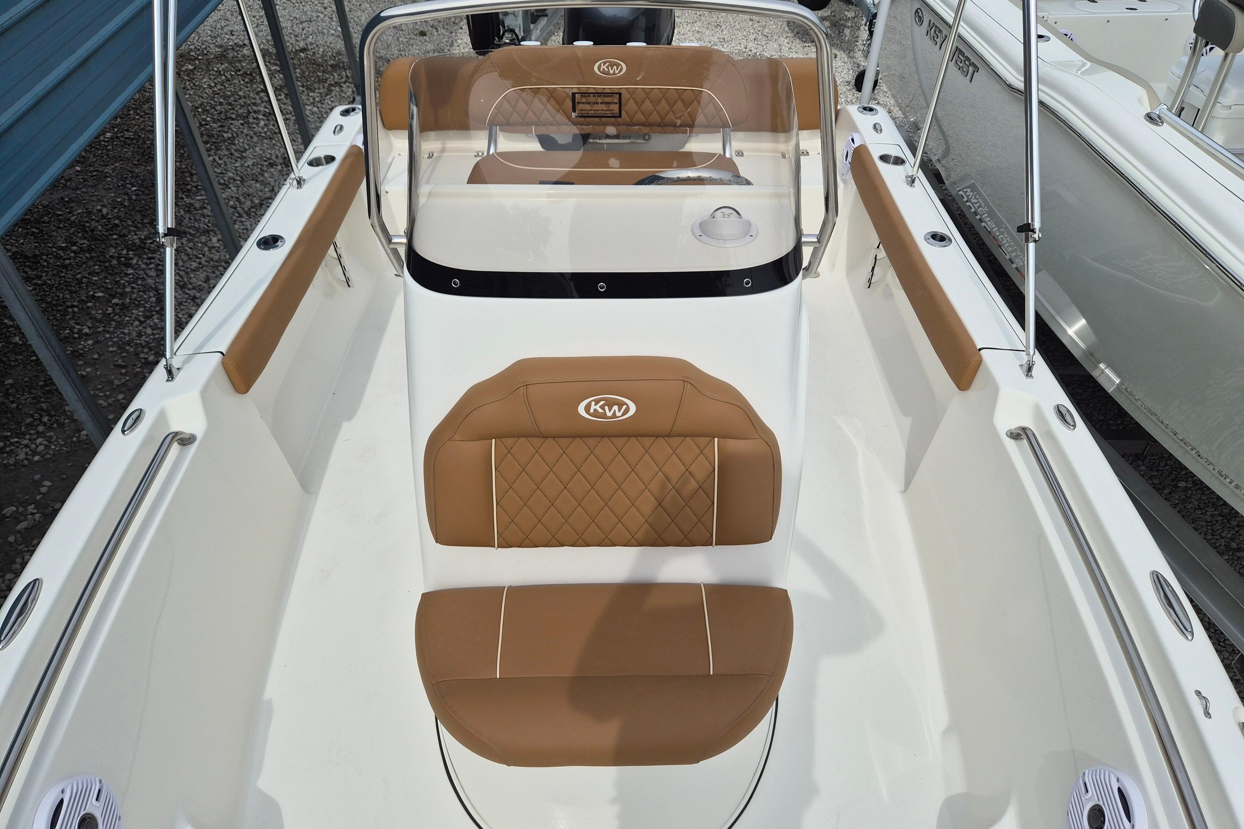 2026 Key West 189 FS boat interior with tan seating and sleek design.