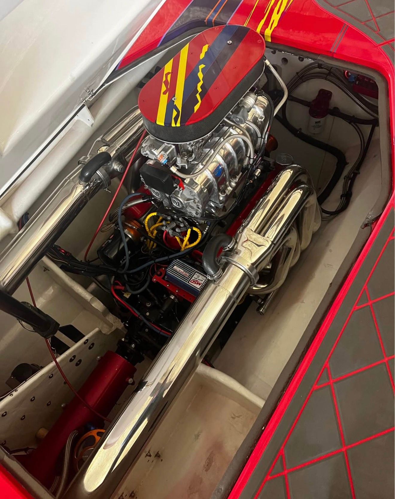 Engine of a 2003 Skater 40 S.S. boat with vibrant colors.