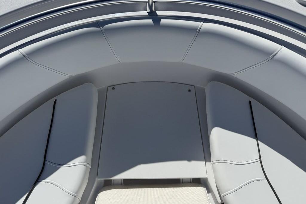 2026 Sportsman Open 232 Center Console boat interior with cushioned seating.