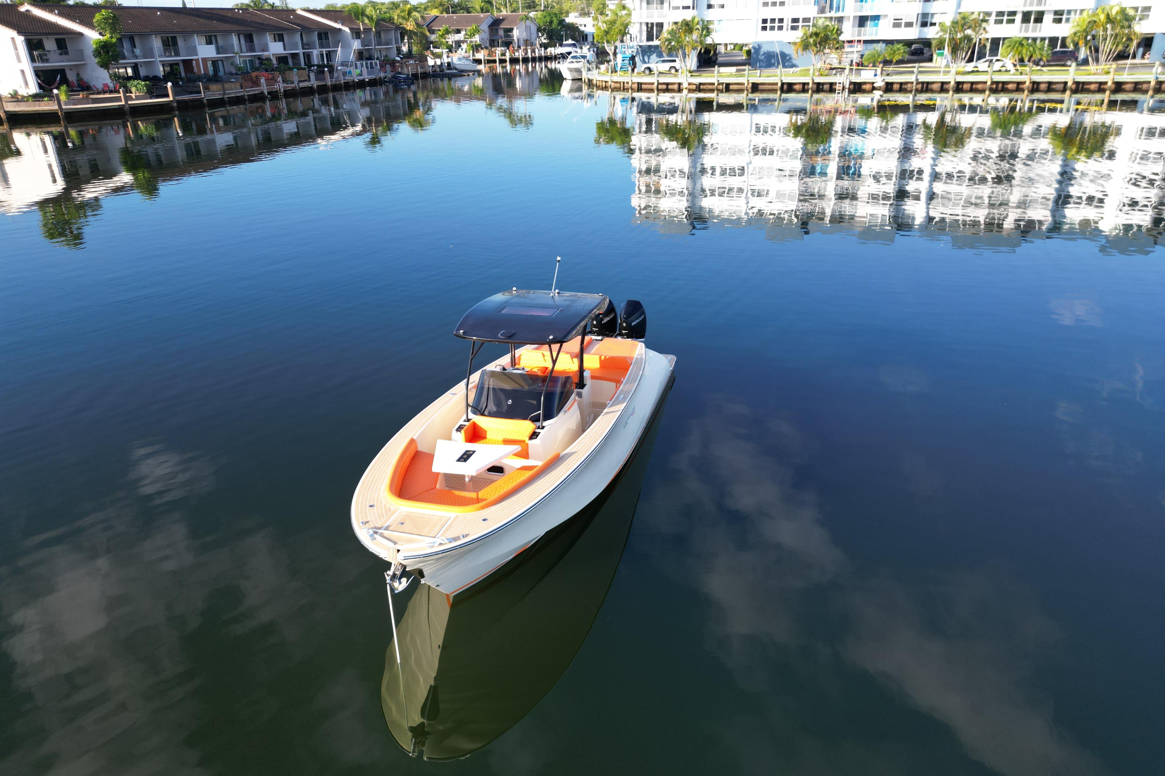 Lilybaeum Lipari 31 boat on calm water, reflecting waterfront buildings, 2026 model.