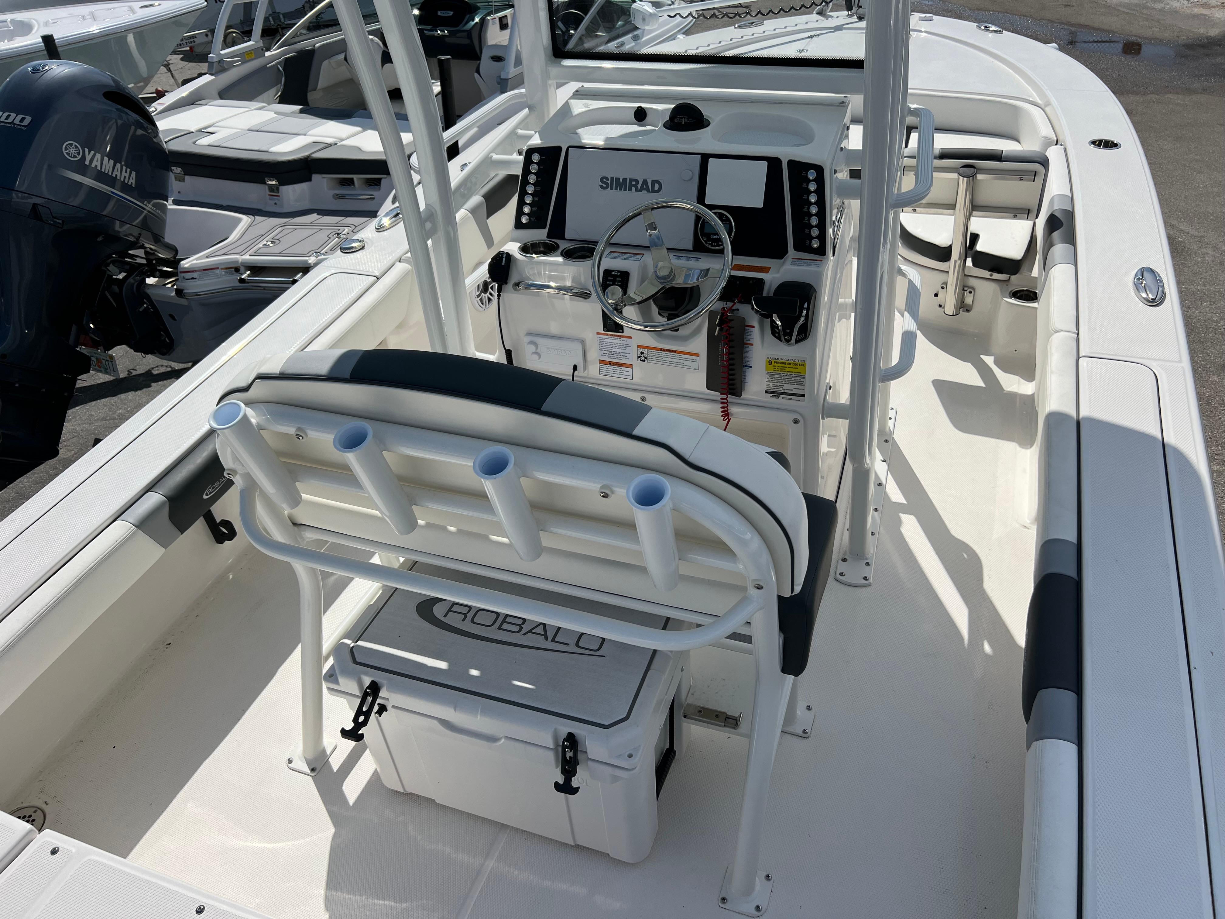 2024 Robalo 246 Sky Deck boat interior with helm station and seating.