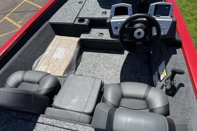 2026 Tracker Pro Team 175 boat interior with steering wheel and seating.