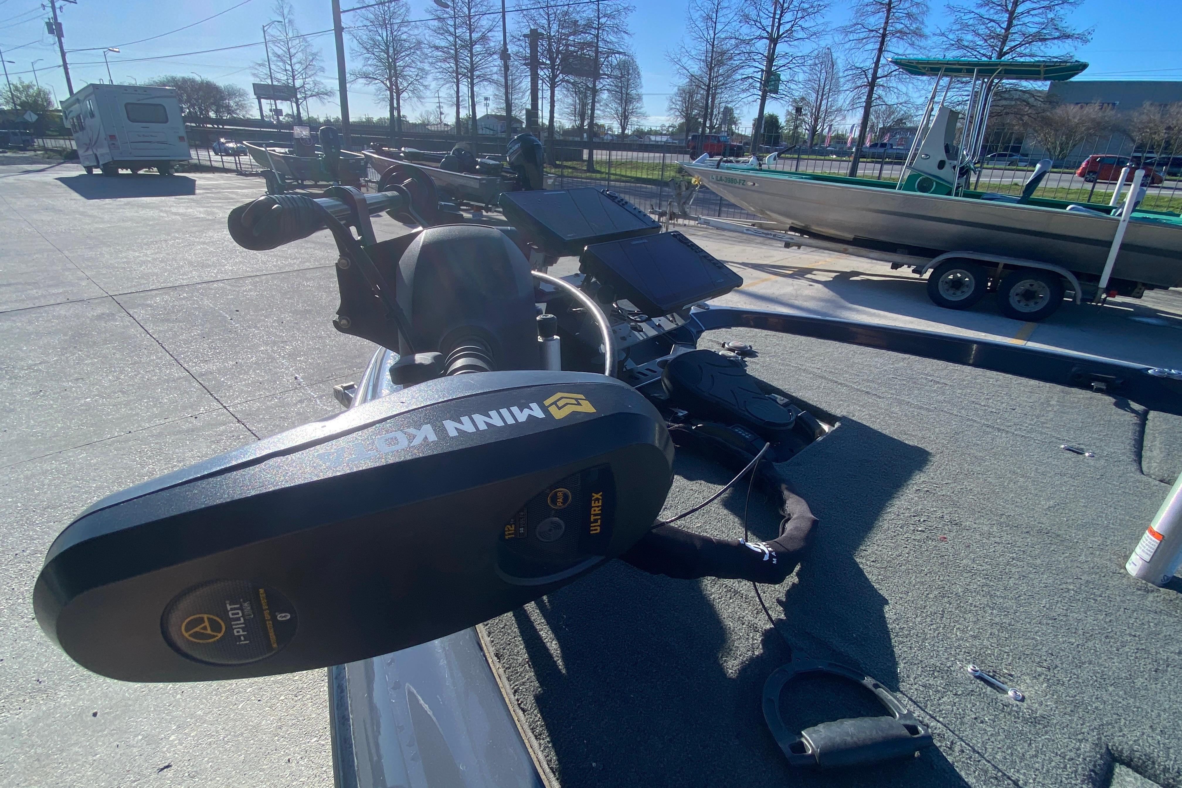 2020 Skeeter FXR20 Limited boat with Minn Kota trolling motor in a parking area.