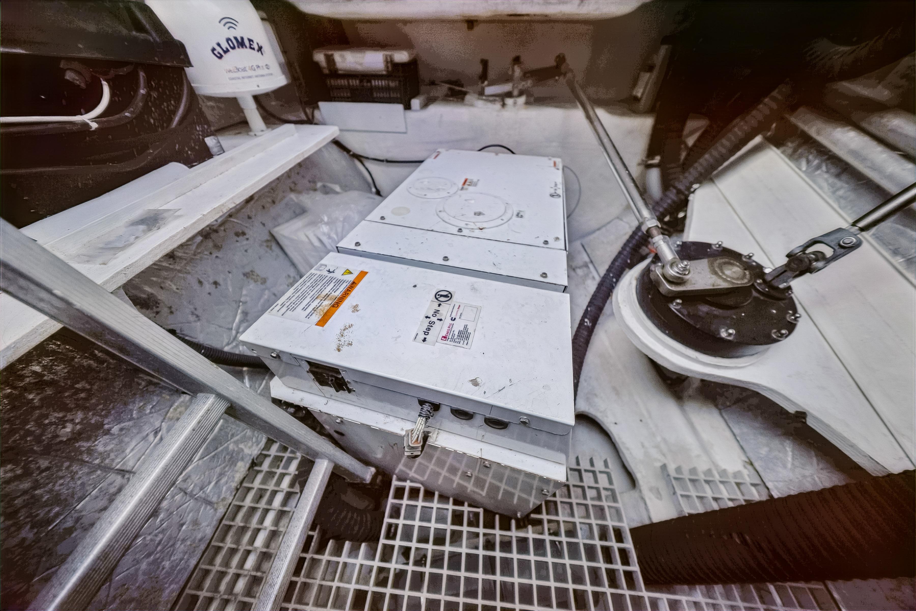 Engine room of a 2009 Catana 65 yacht, featuring mechanical components and equipment.