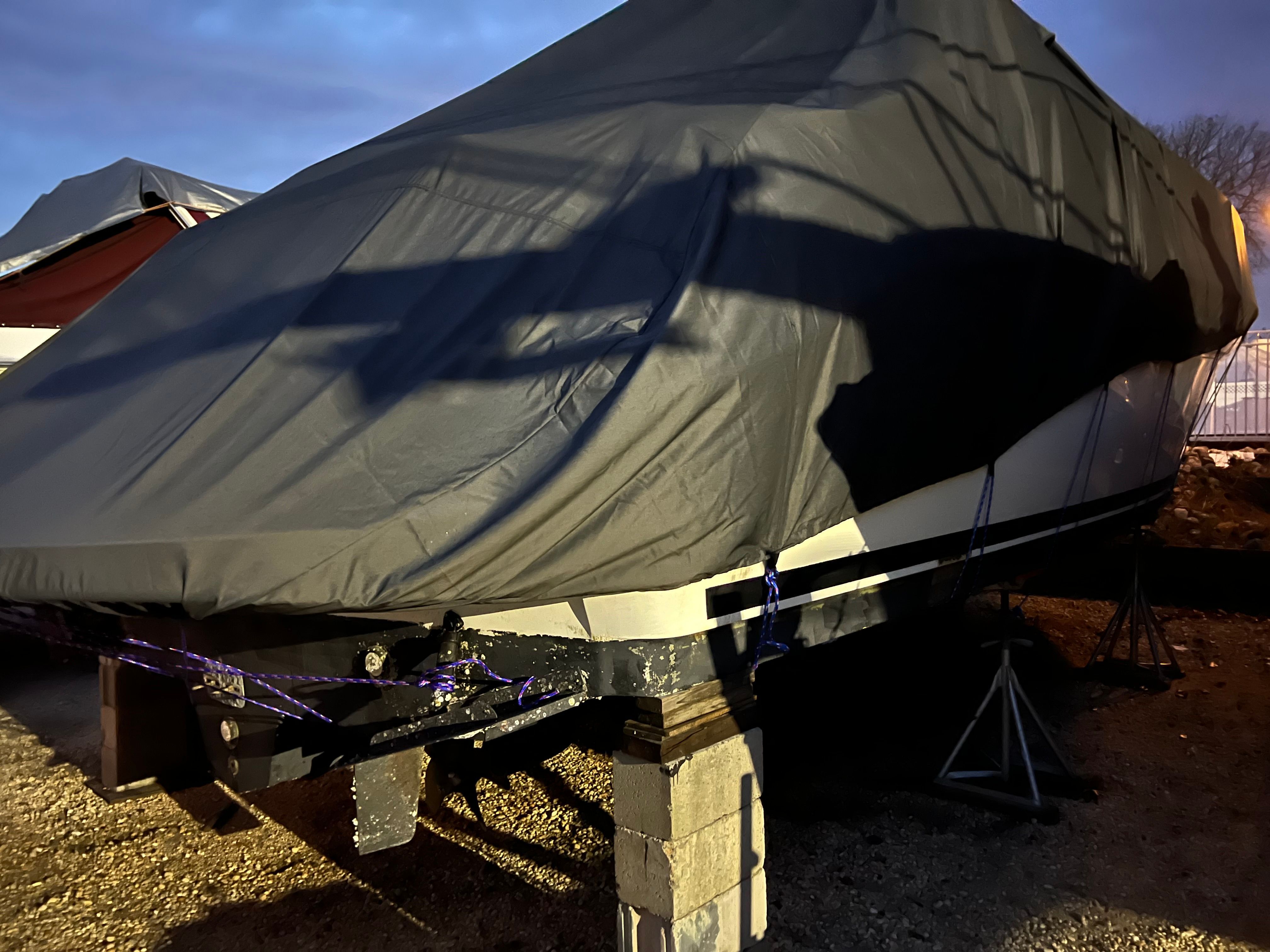 Covered Sea Ray 380 Sundancer boat on stands, year 2003.