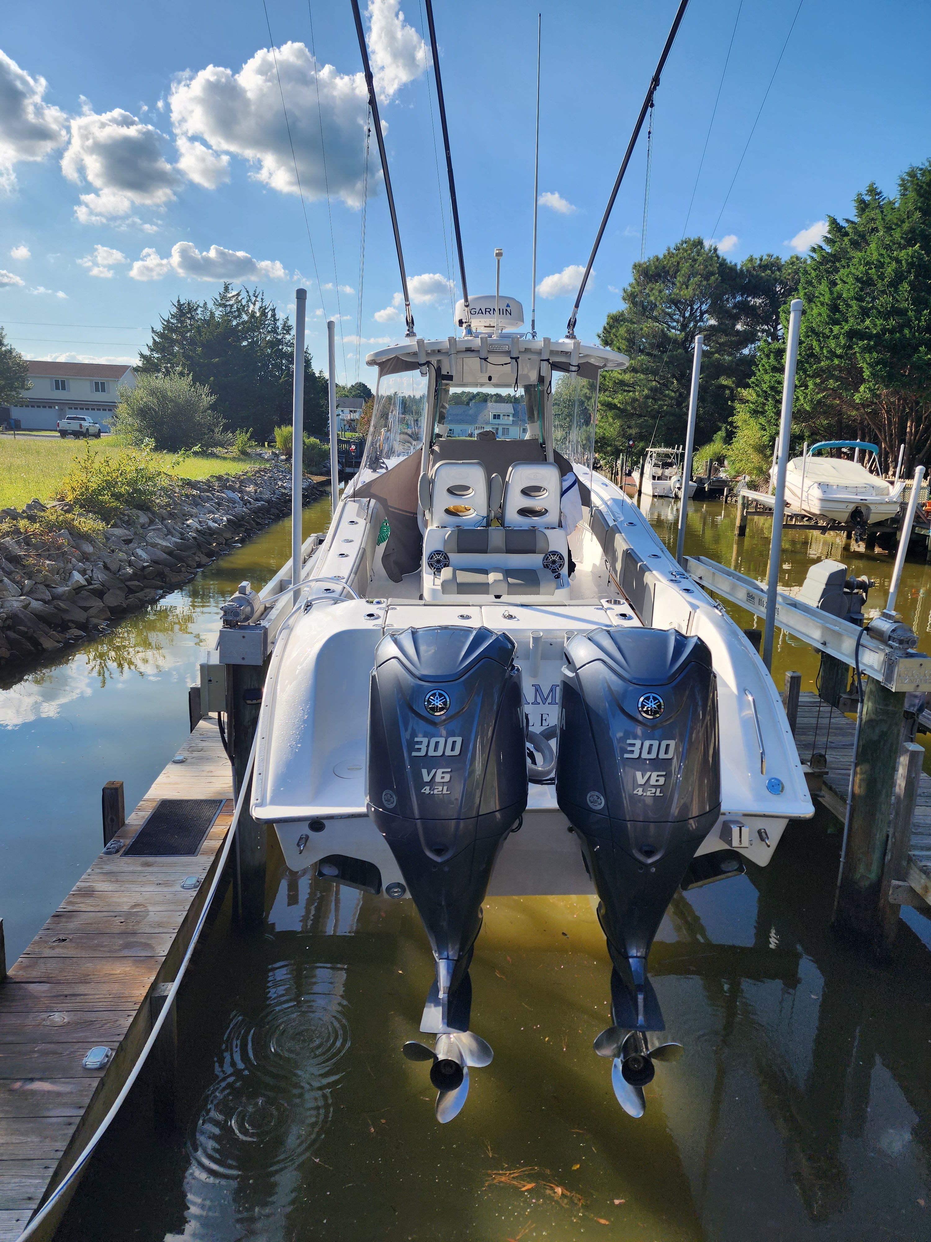 2021 Cape Horn 32 XS boat with twin outboard engines docked.