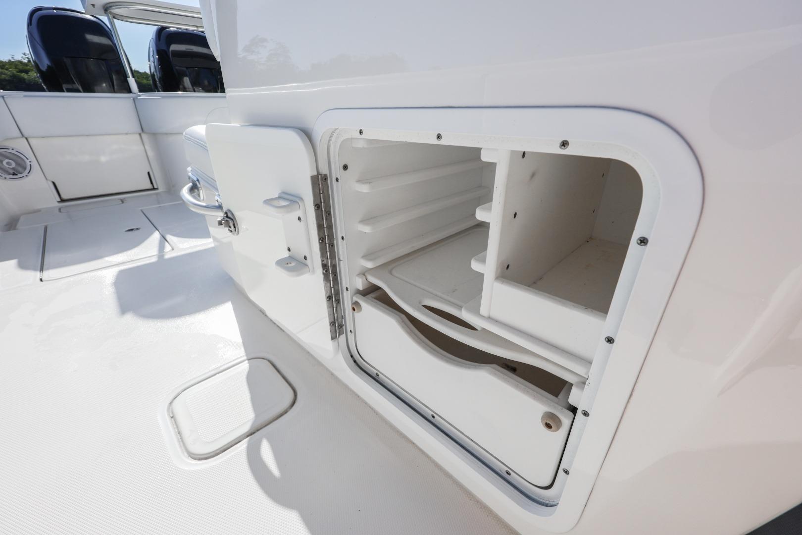 Open storage compartment on 2016 Invincible 39 Open Fisherman boat deck.