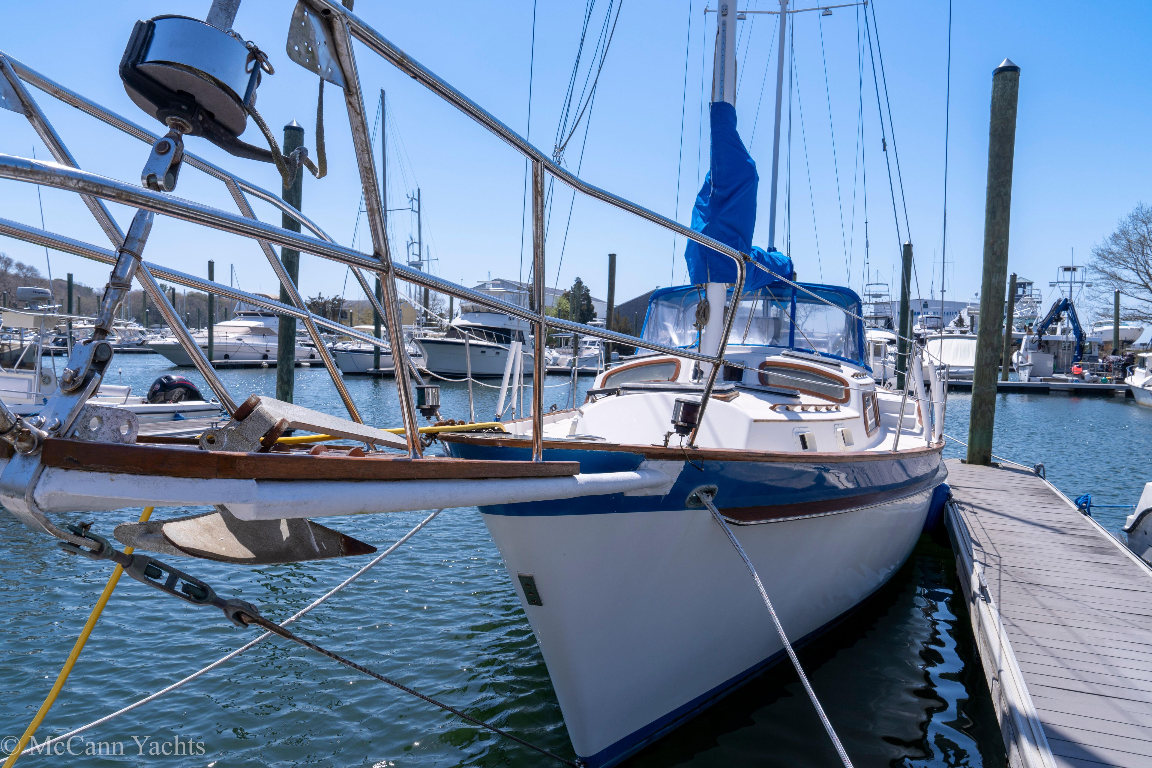 1980 Irwin 46 sailboat docked at marina, featuring sleek design and blue accents.