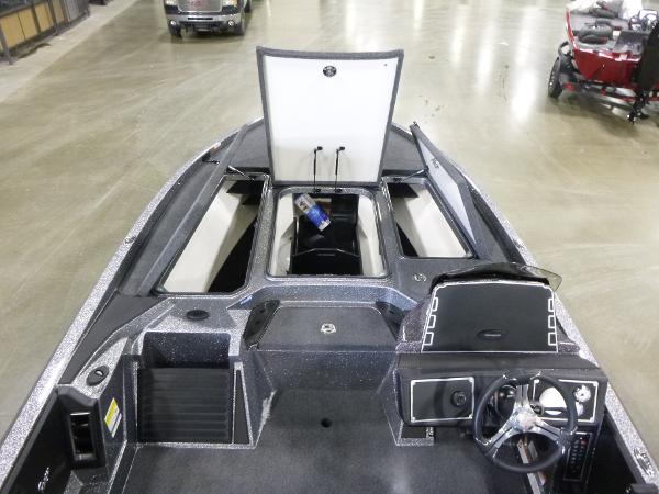 2025 Ranger Z520 boat interior with open storage compartments and steering console.