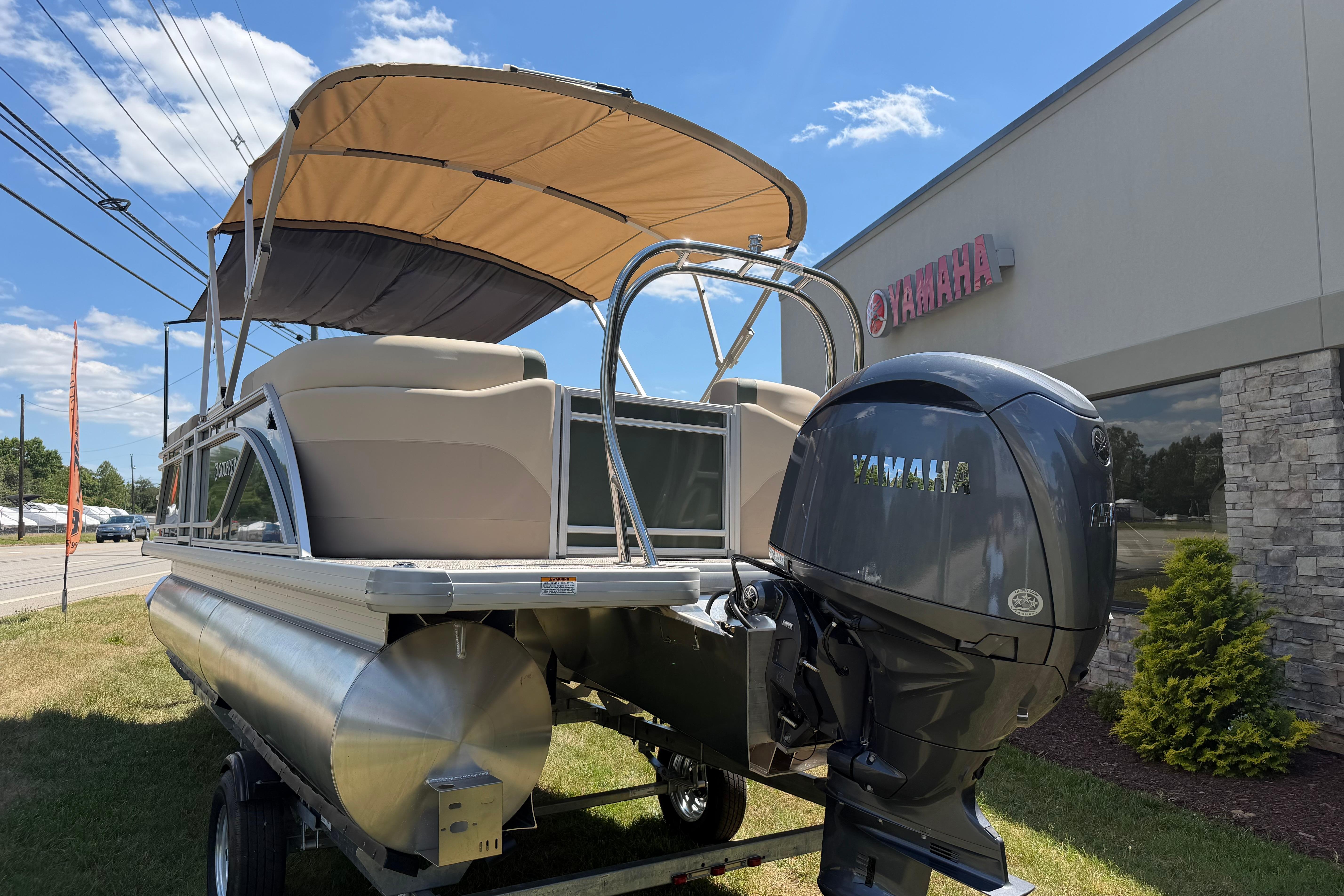 2026 Godfrey SW 2086 SBC pontoon boat with Yamaha outboard motor, parked outdoors.