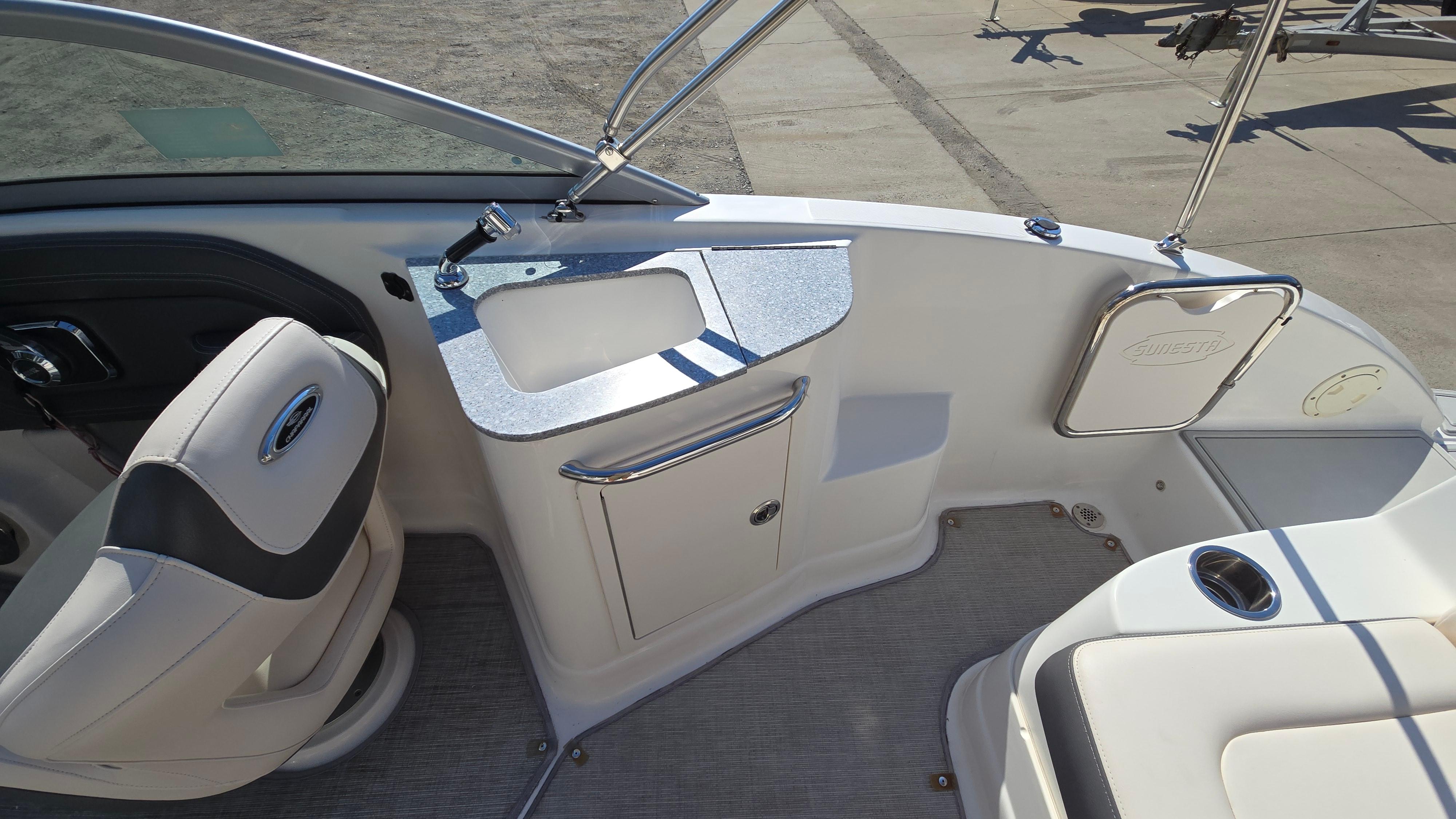 2018 Chaparral 224 Sunesta boat interior with seating and sink area.