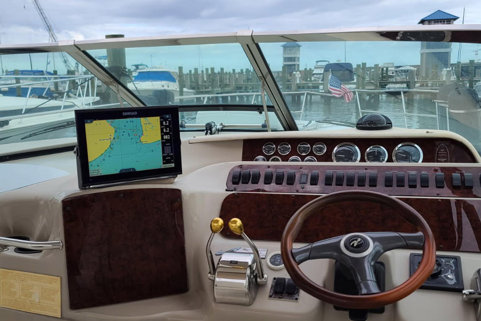 Cockpit view of a 1998 Sea Ray Sundancer 400 with navigation display and controls.