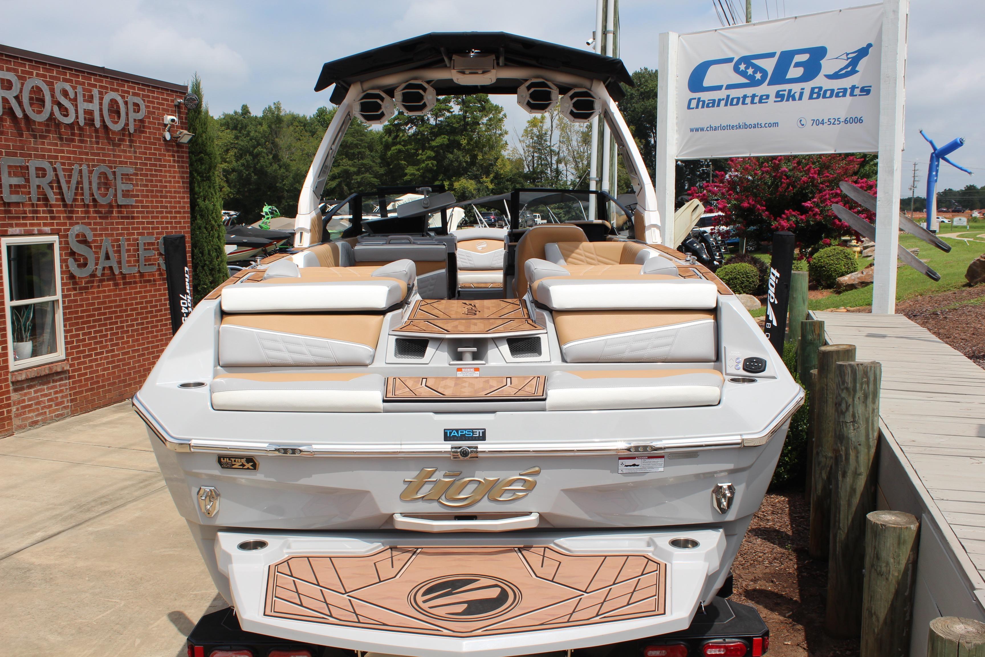2024 Tigé Ultré 25ZX boat at Charlotte Ski Boats dealership, showcasing luxury design.