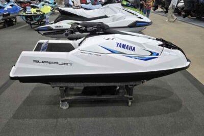 2026 Yamaha WaveRunner SuperJet displayed indoors on a stand.