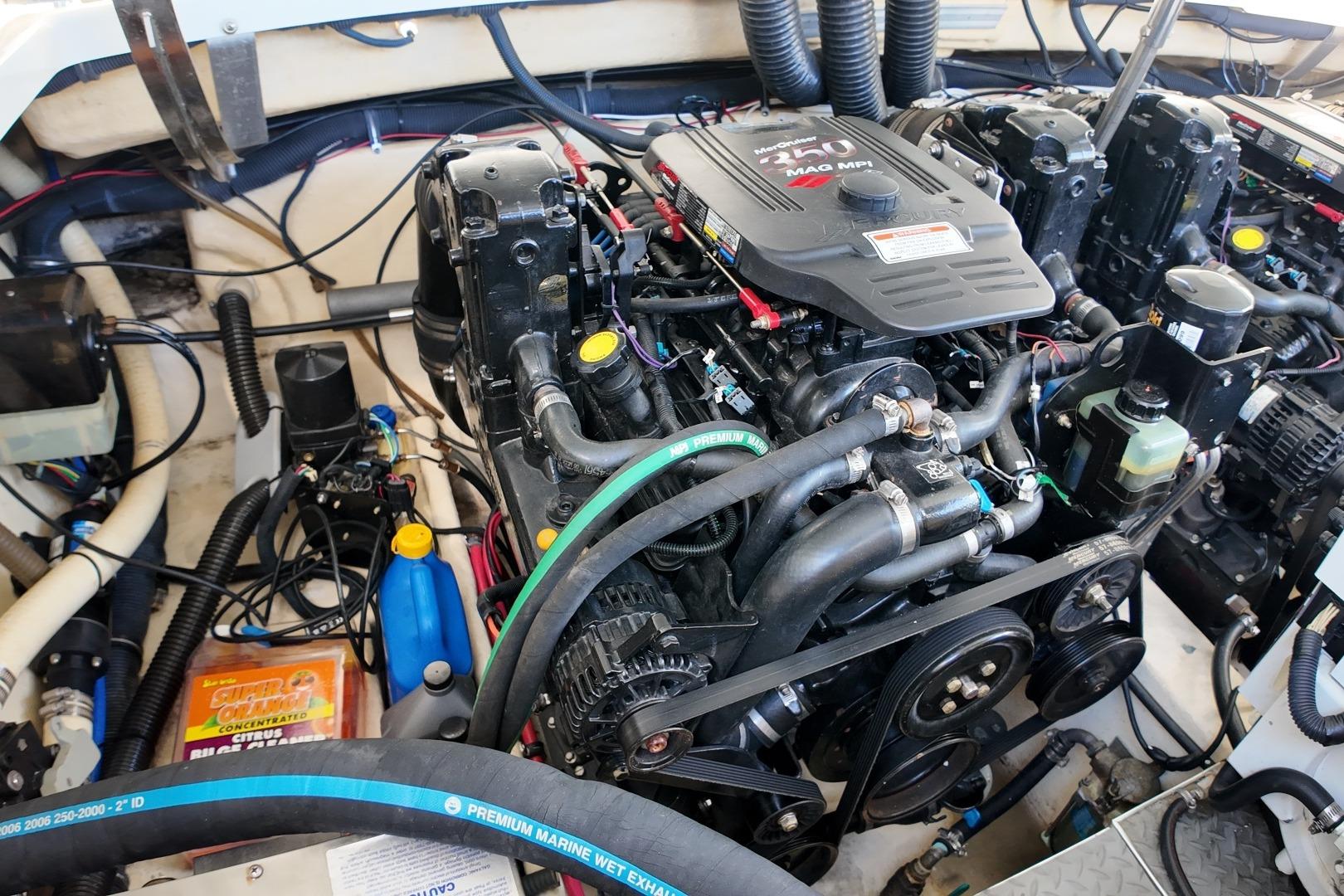 Engine compartment of a 2007 Formula 330 Sun Sport boat, showcasing detailed mechanical components.