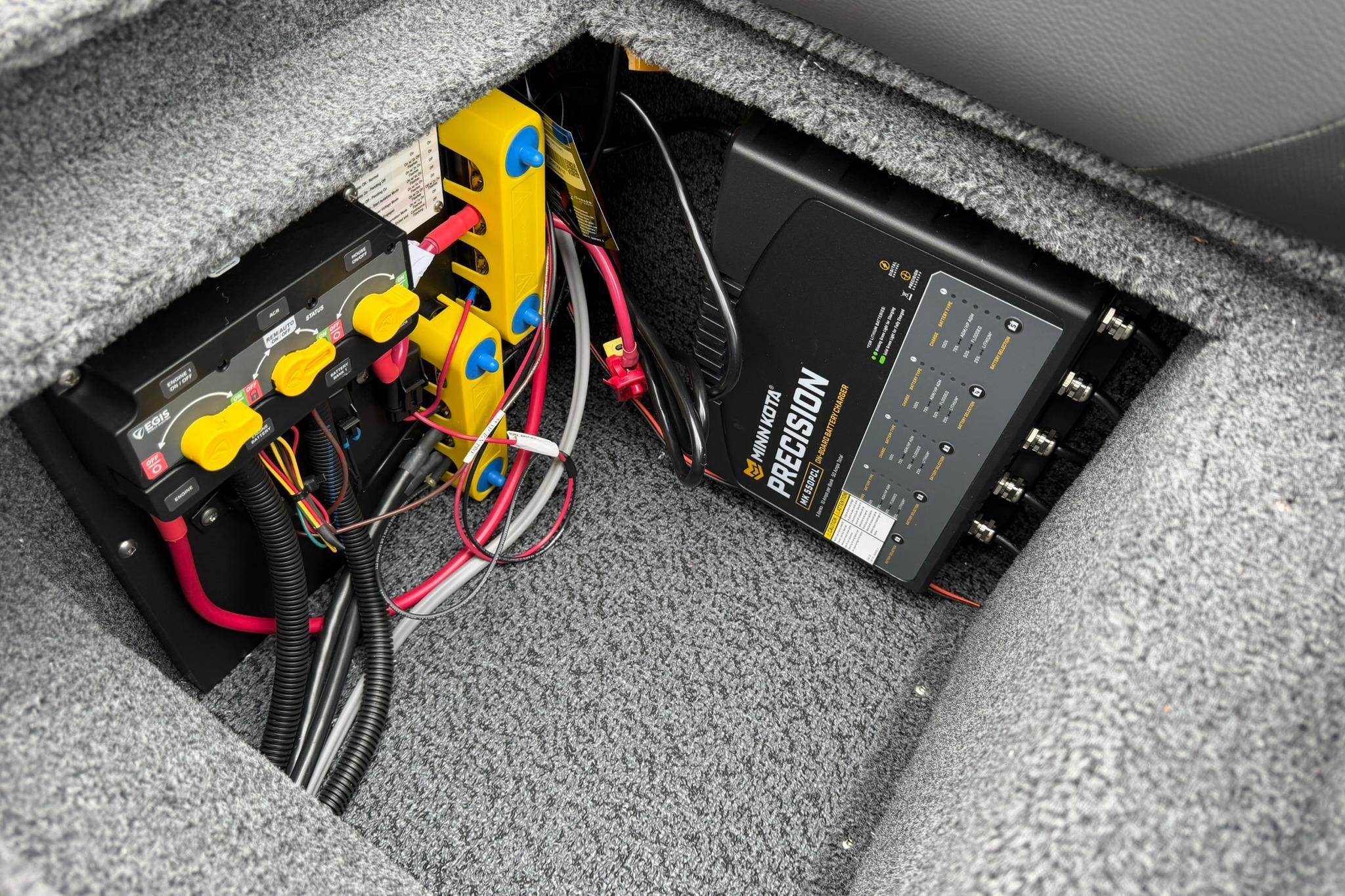 Electrical system of 2027 Lund 2075 Impact XS boat, featuring wiring and precision components.