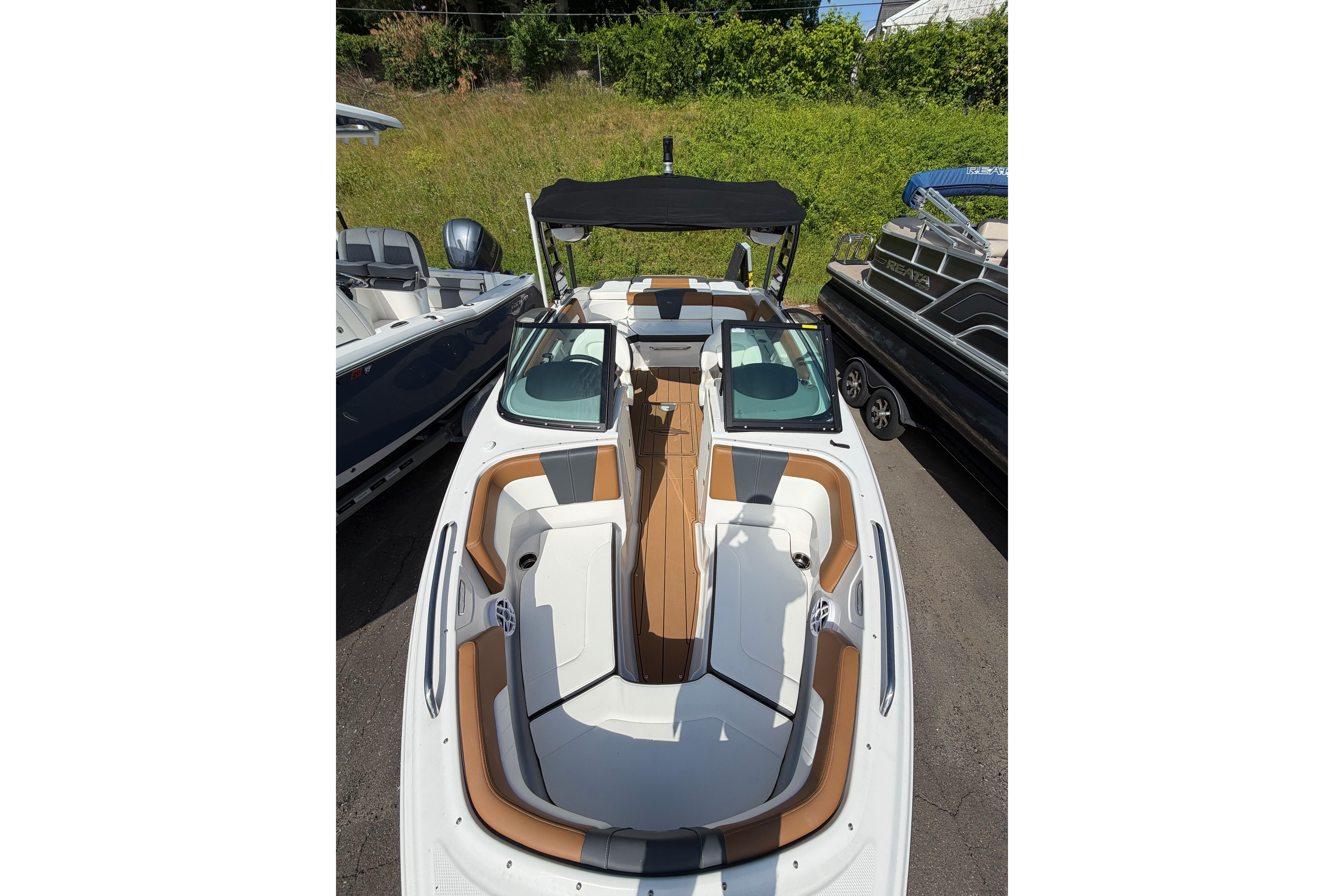 2025 Chaparral 230 SSi boat with sleek interior design and comfortable seating.
