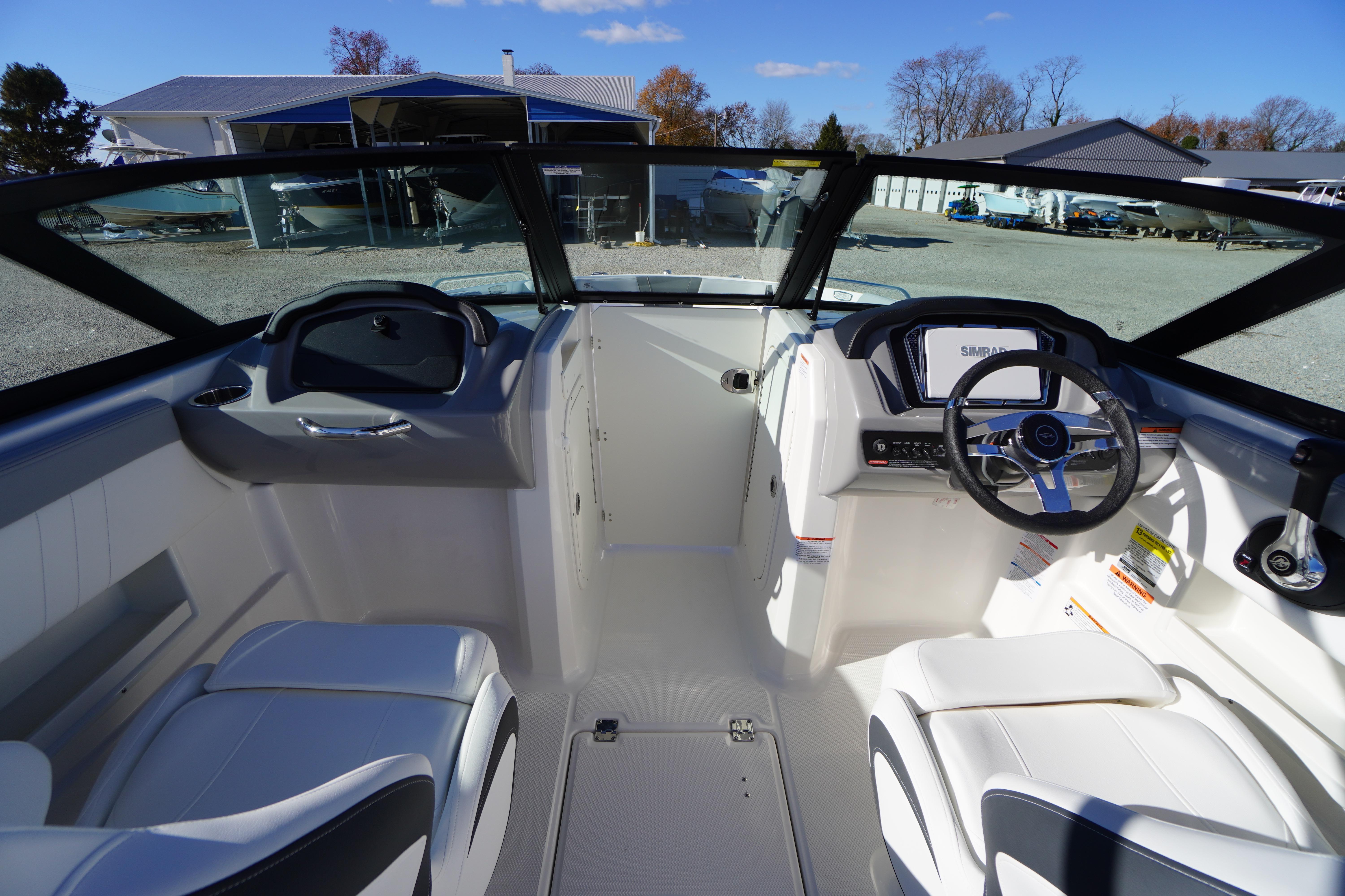 2026 Chaparral 23 SSi boat interior with modern dashboard and seating.