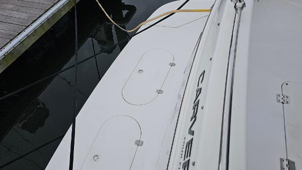 Carver 450 Voyager Pilothouse 2000 docked, showing deck details and mooring lines.
