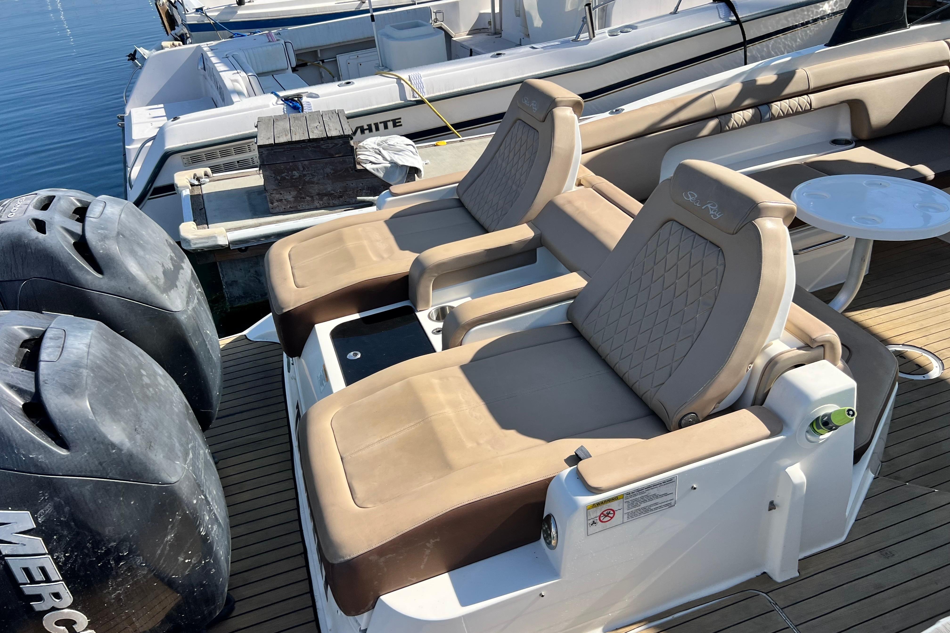 2016 Sea Ray 290 Sundeck Outboard with beige seating and dual Mercury engines.