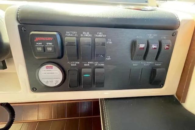 Control panel of a 2016 Sea Ray Sundancer 510 yacht, featuring various switches and gauges.