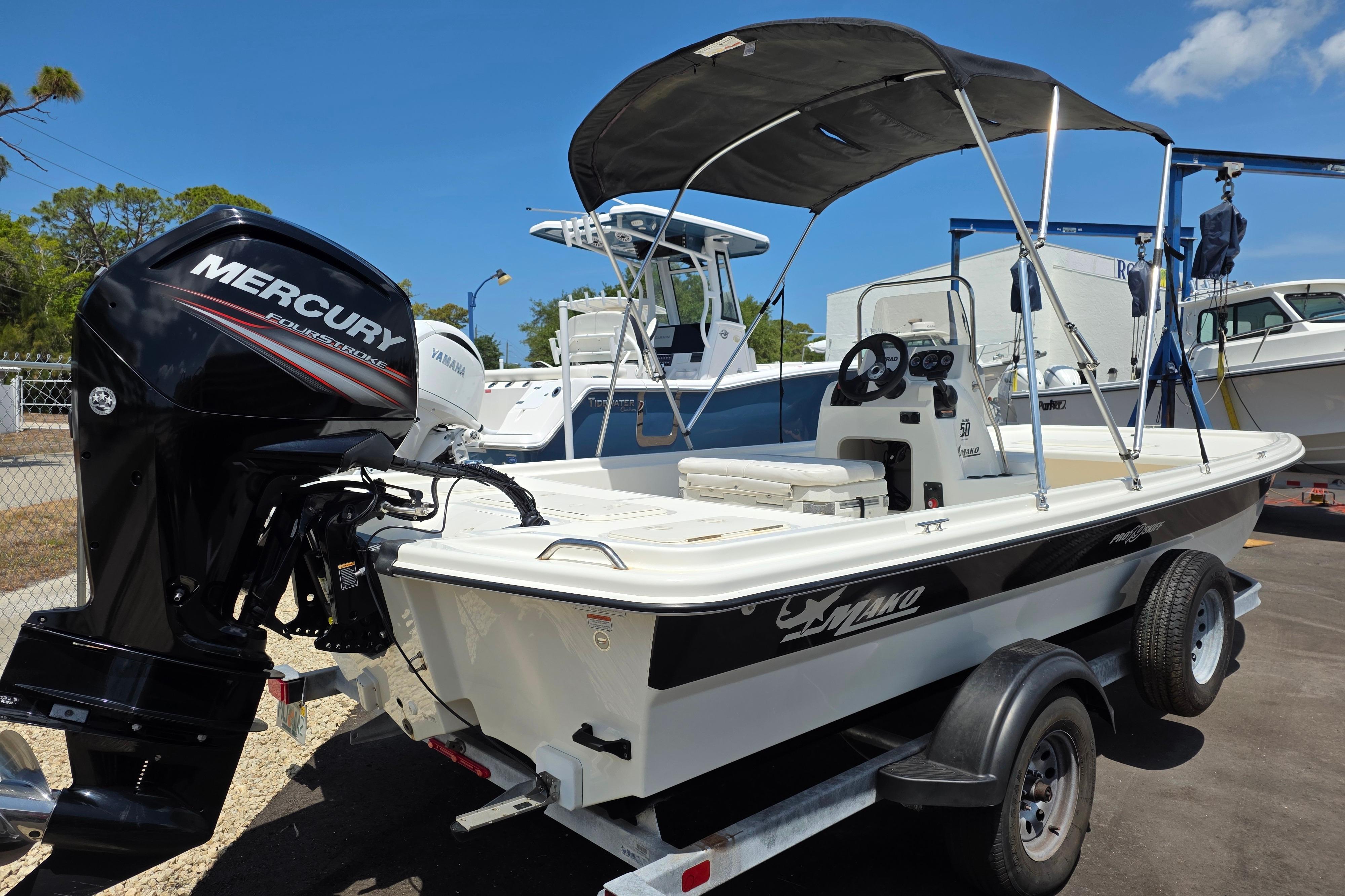 2018 Mako Pro Skiff 19 CC boat with Mercury outboard engine on trailer.