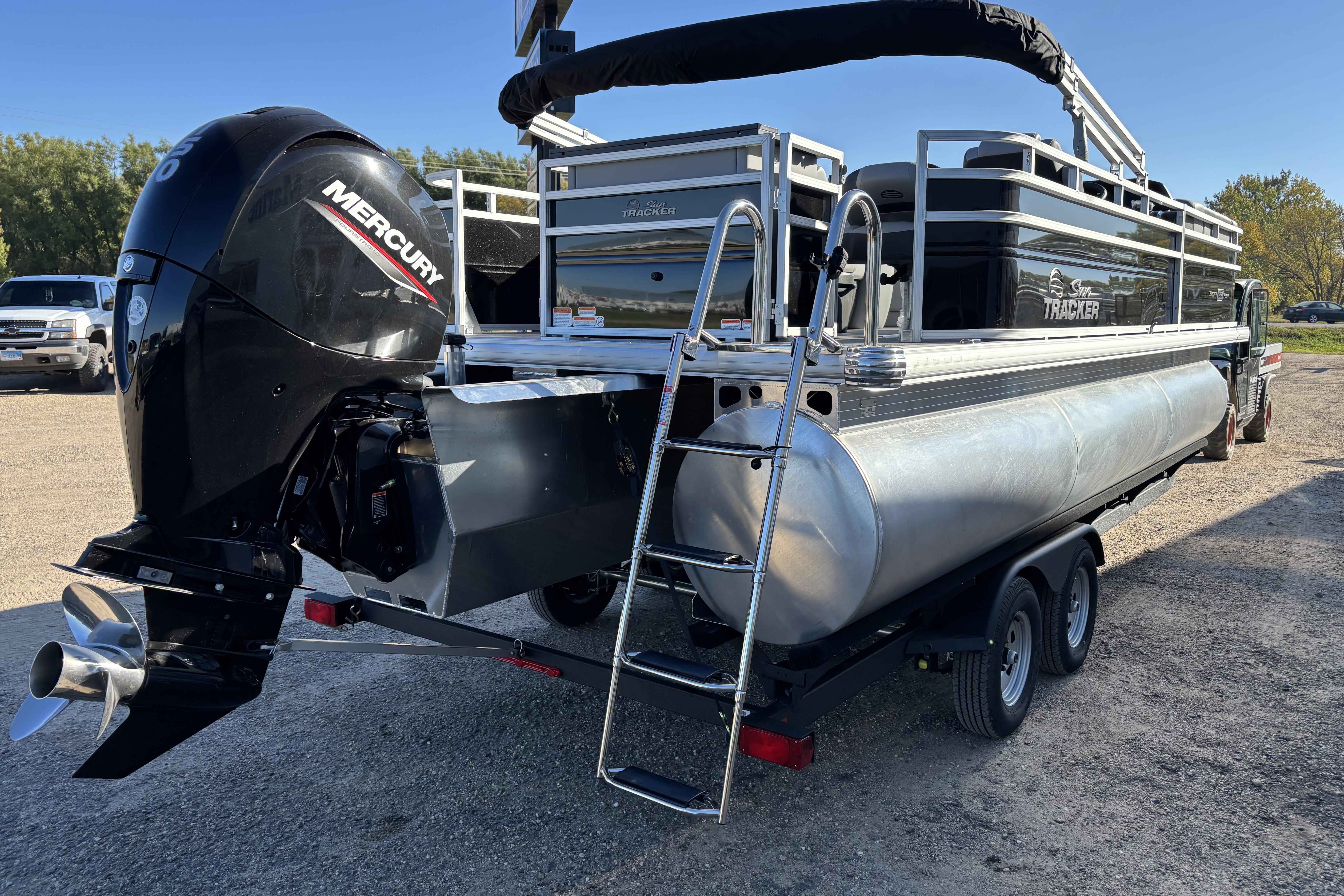 2026 Sun Tracker SportFish 22 XP3 pontoon boat with Mercury outboard engine.