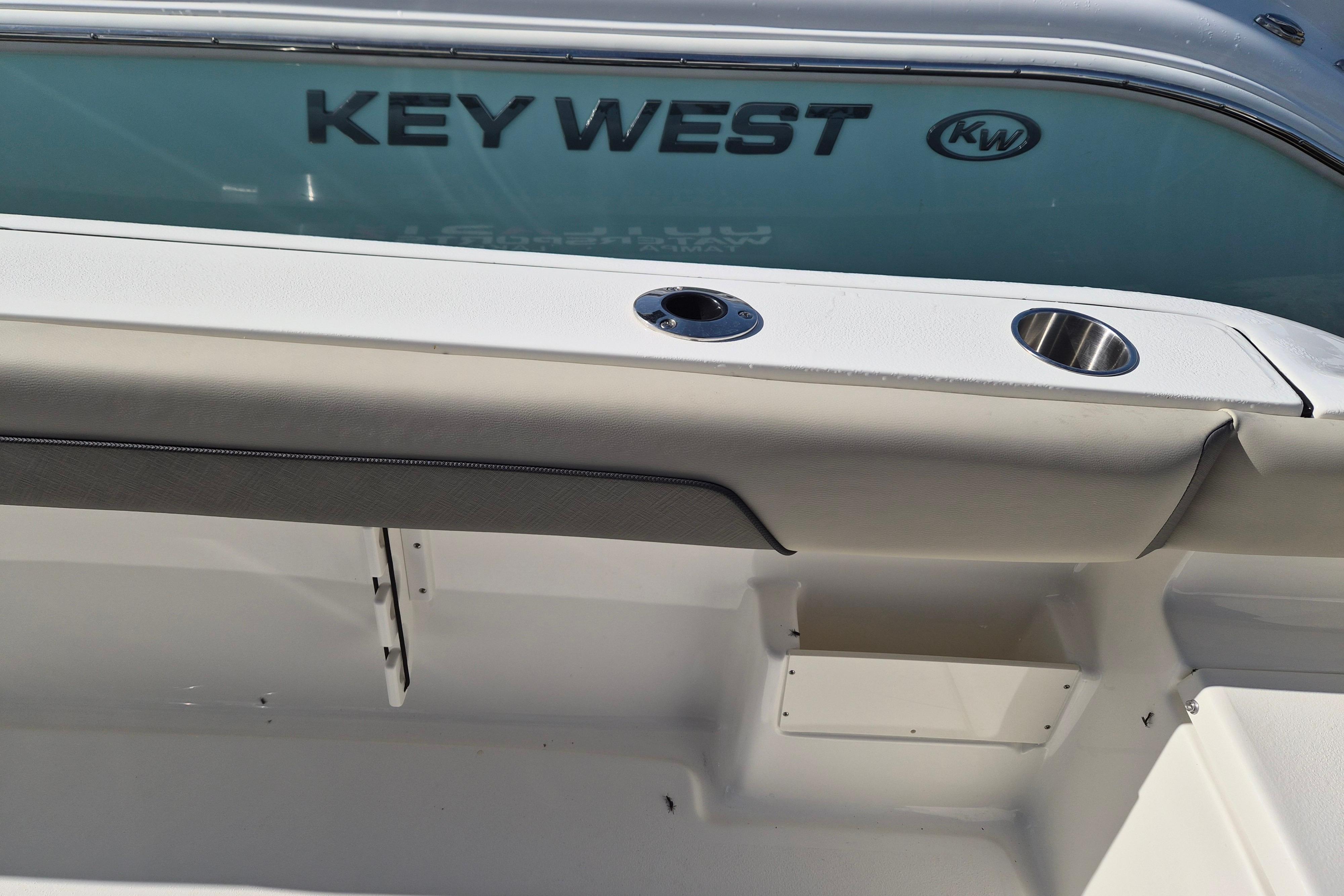 2026 Key West 239 FS boat interior with cup holders and branding.