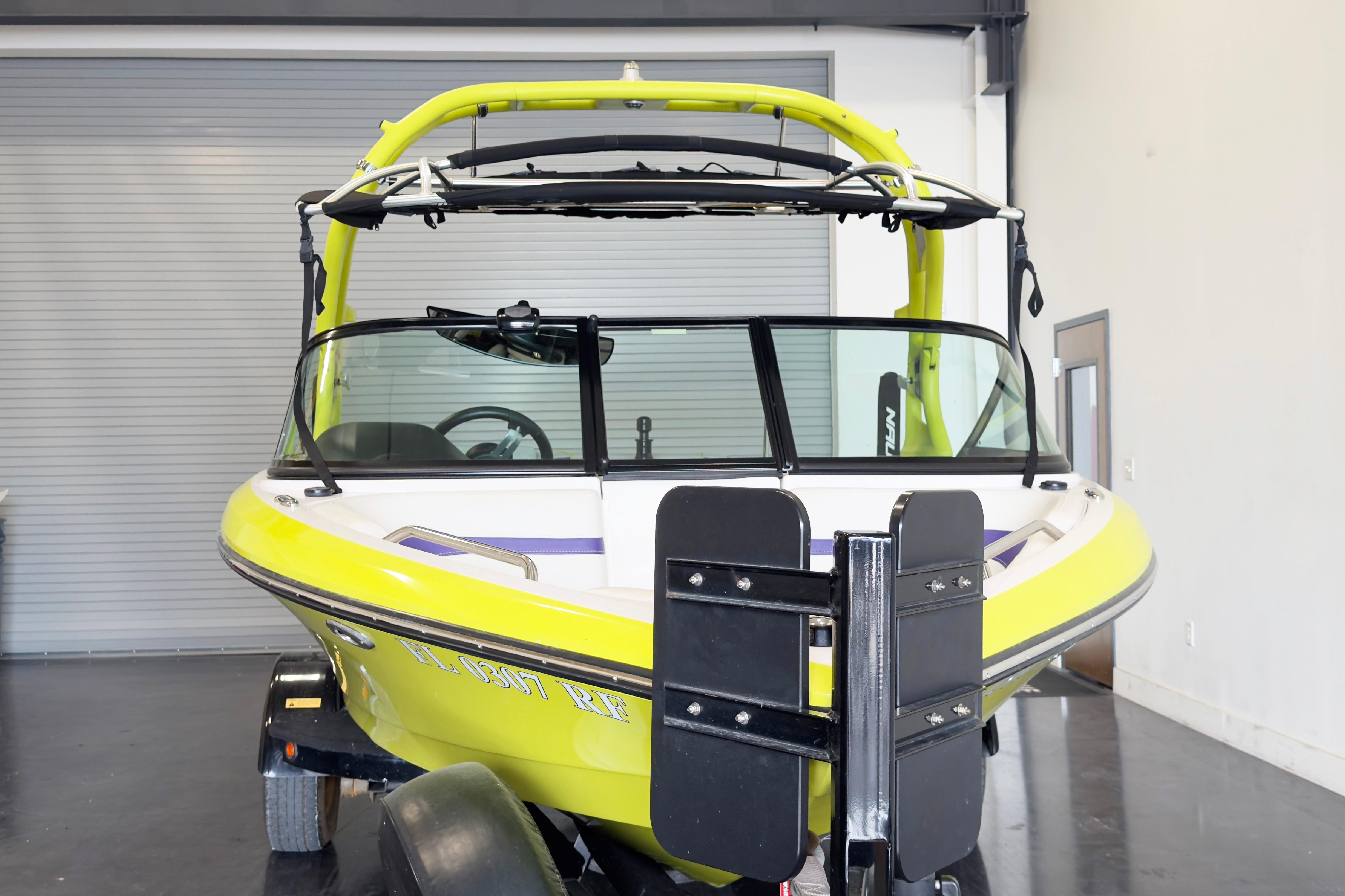 2014 Nautique Ski Nautique 200 Closed Bow boat in a garage setting.