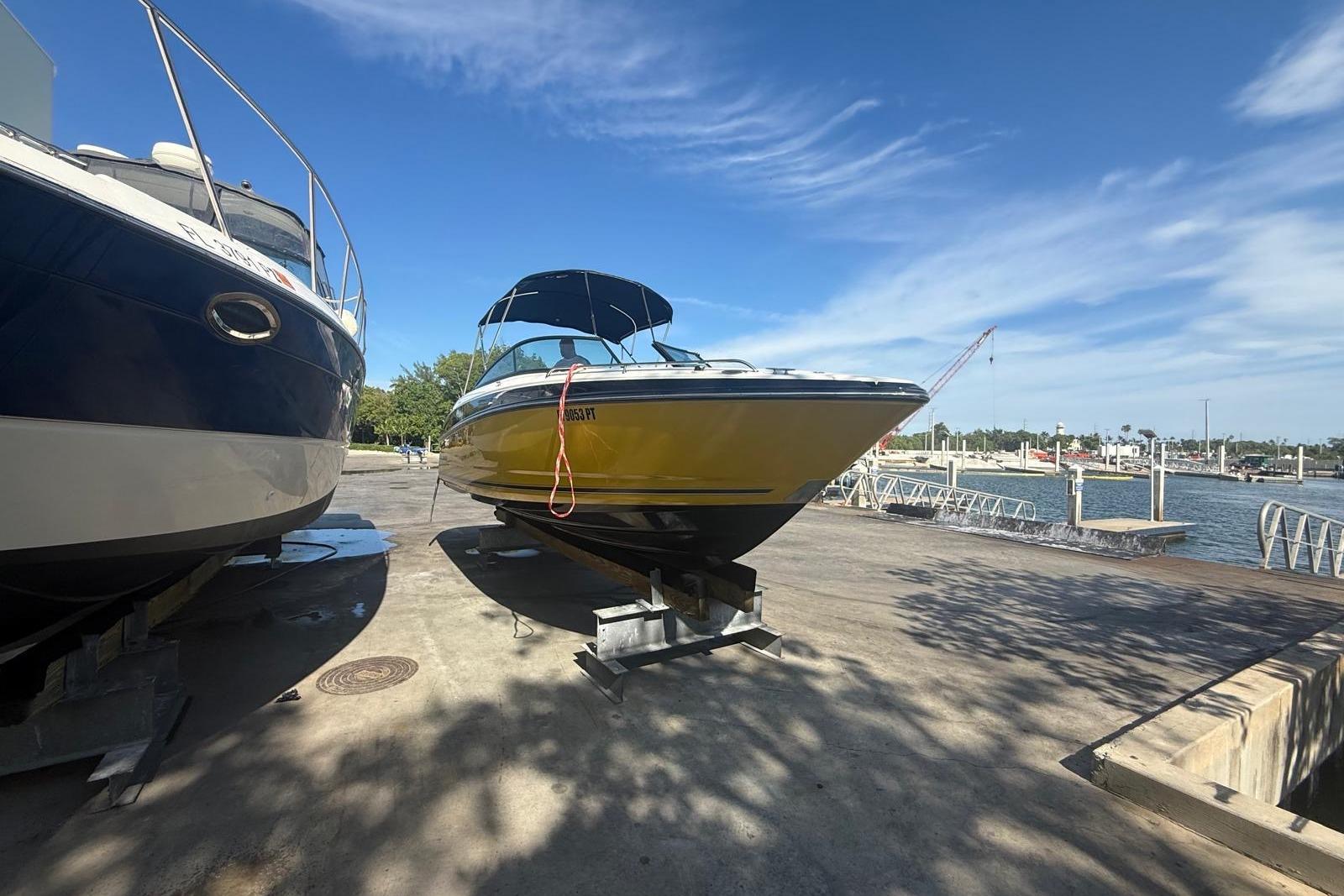 2015 Monterey 264FS boat on dock, sunny day, marina background.