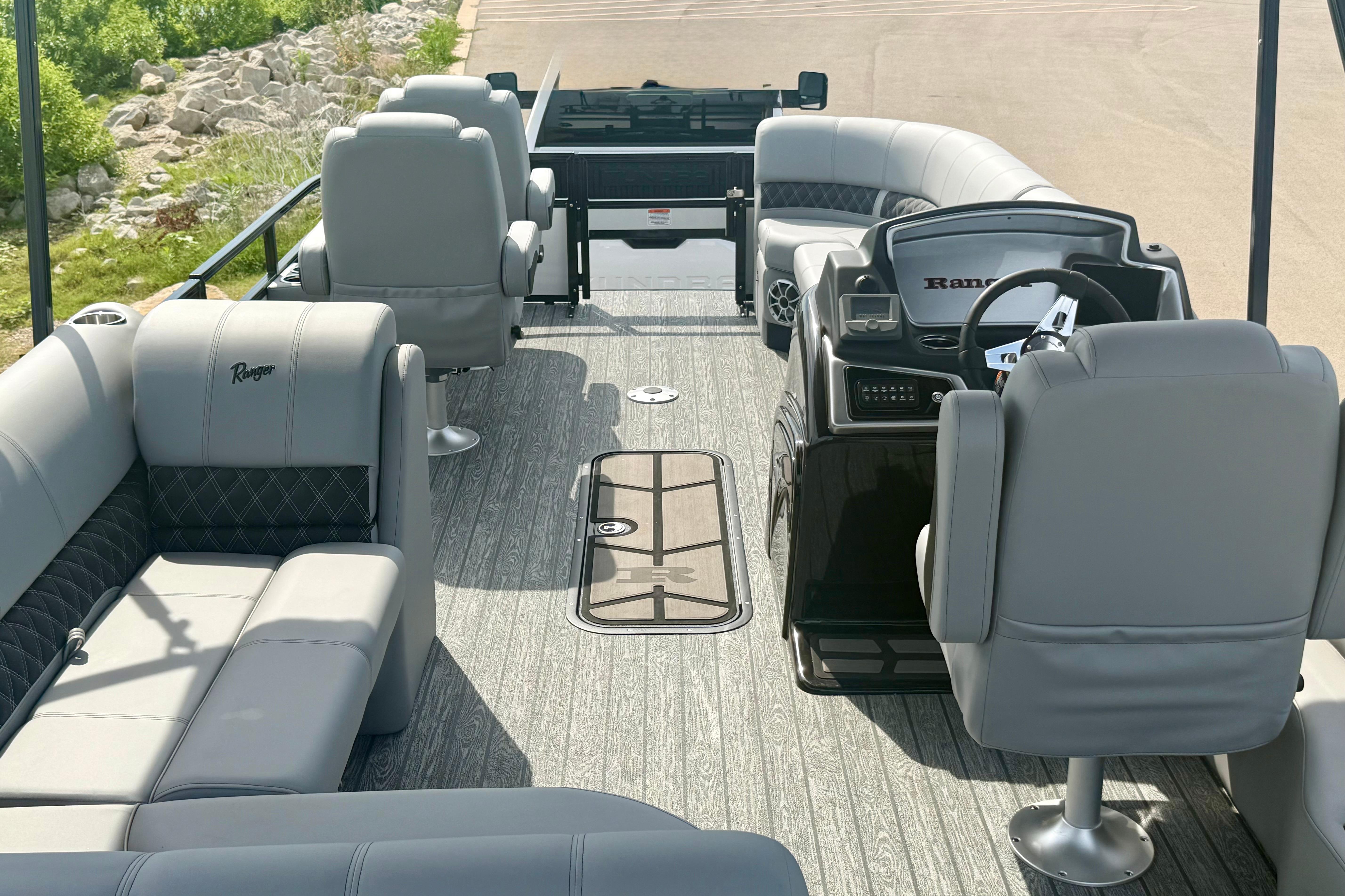 Luxurious interior of 2026 Ranger 223FC boat with plush seating and modern helm.