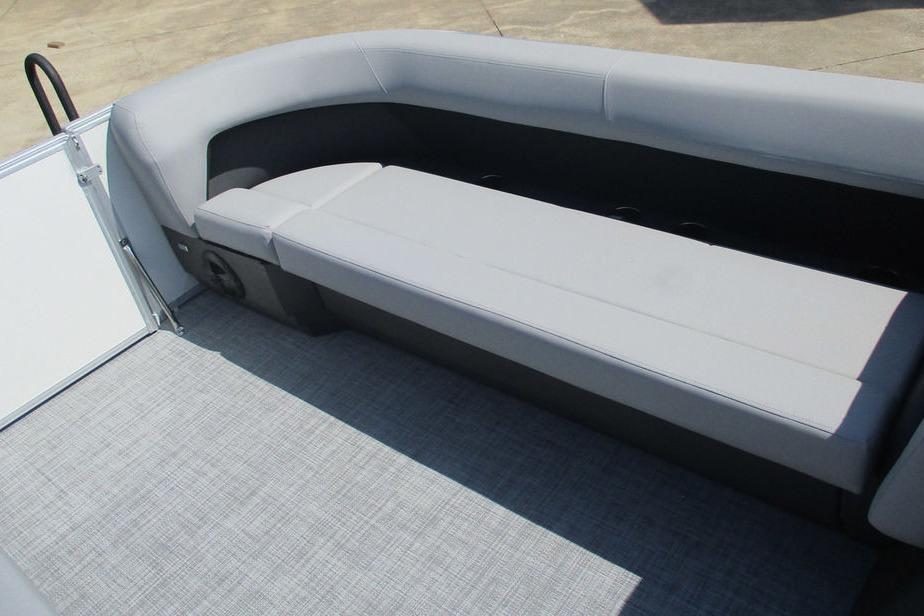 2026 Sun Tracker Party Barge 18 DLX interior with gray seating and flooring.