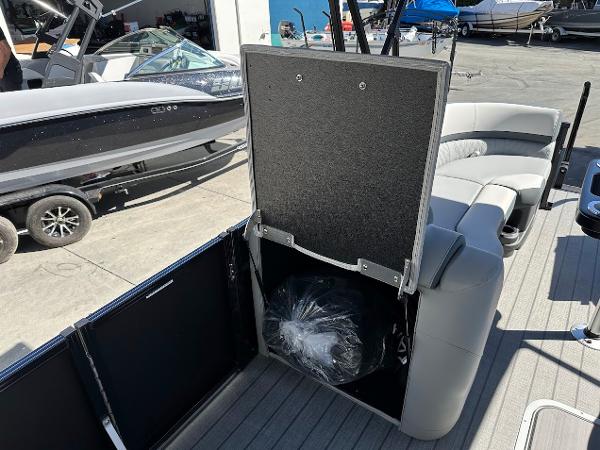 2025 Tahoe Pontoon 2585 LTZ Entertainer interior with storage compartment open.