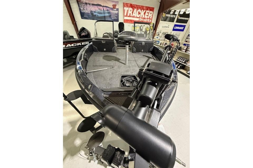 2024 Nitro ZV21 fishing boat displayed in showroom with equipment and accessories.