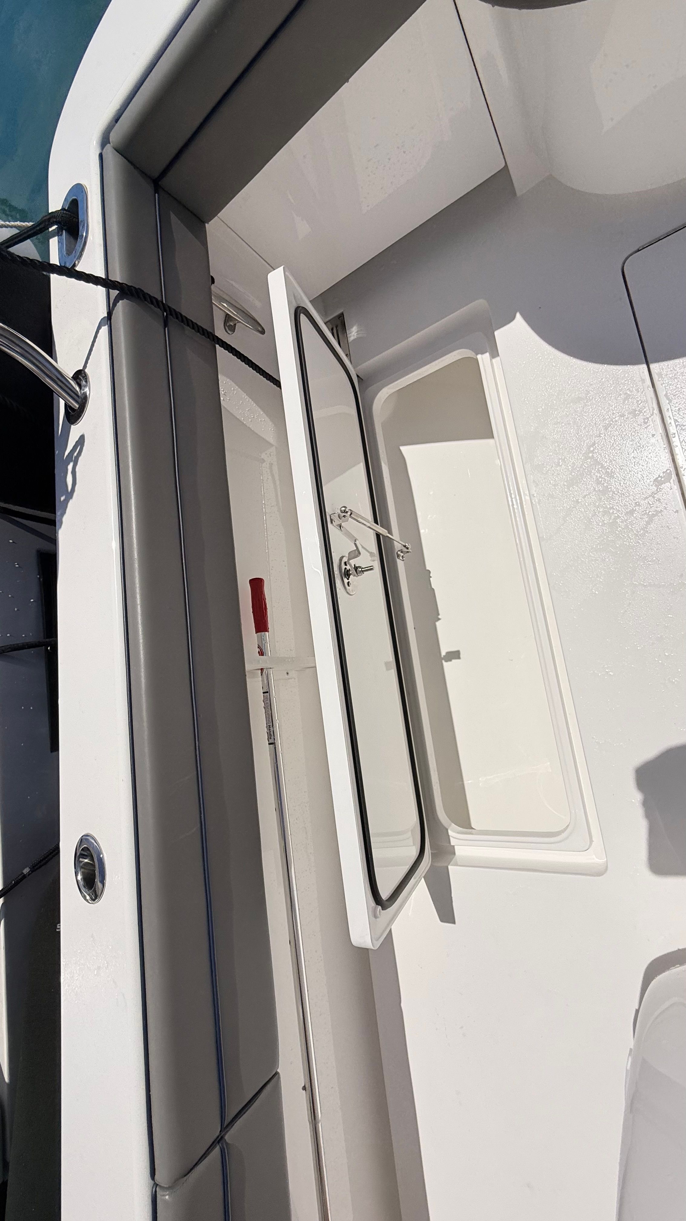 Valhalla Boatworks V33 2026, open storage hatch on deck.