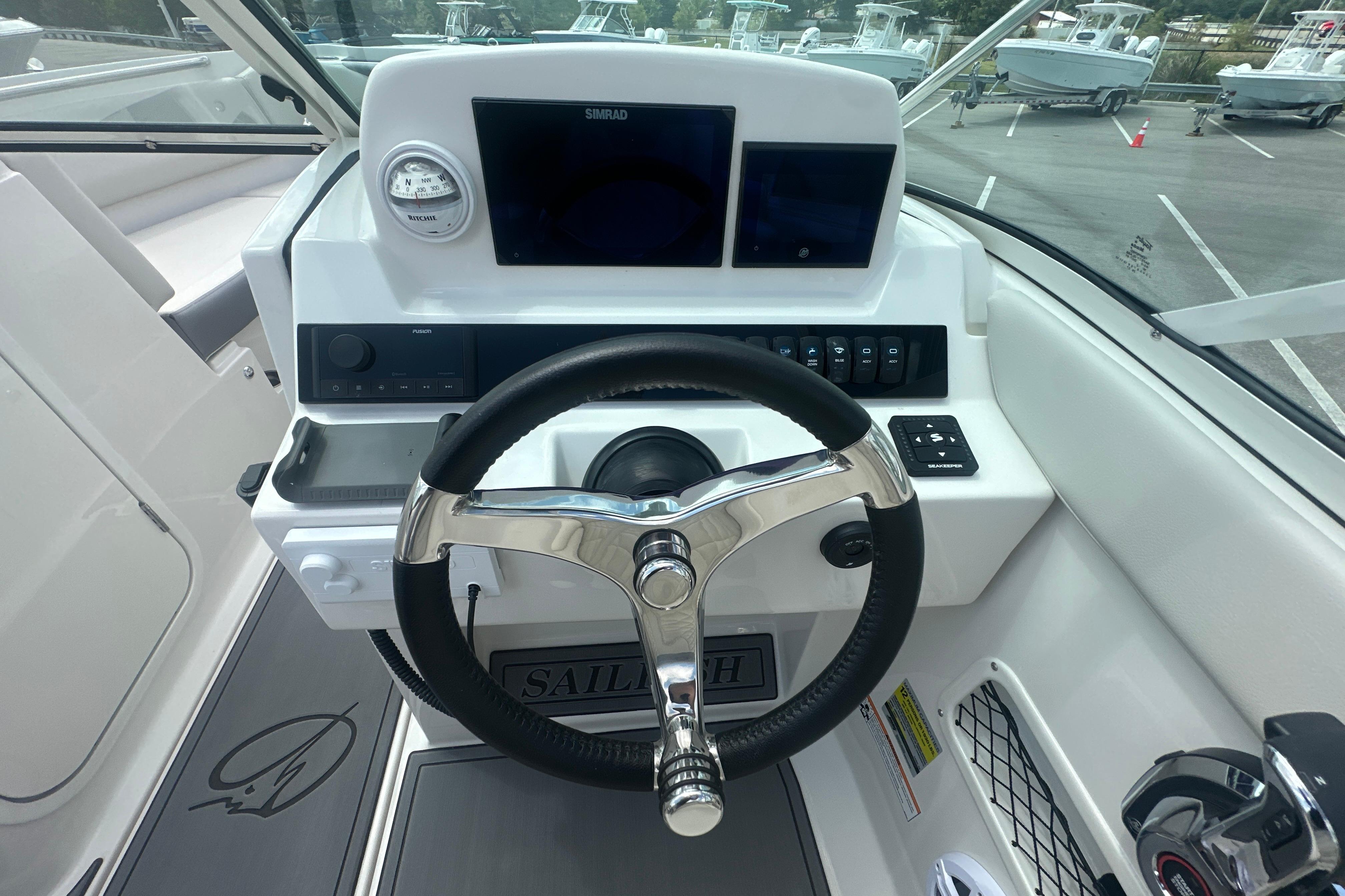 Helm of 2026 Sailfish 226 DC boat with modern controls and steering wheel.