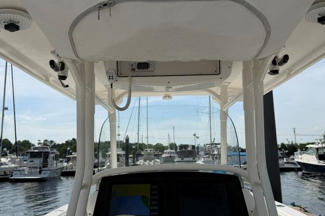 2014 Edgewater 318CC boat dashboard with marina view in the background.