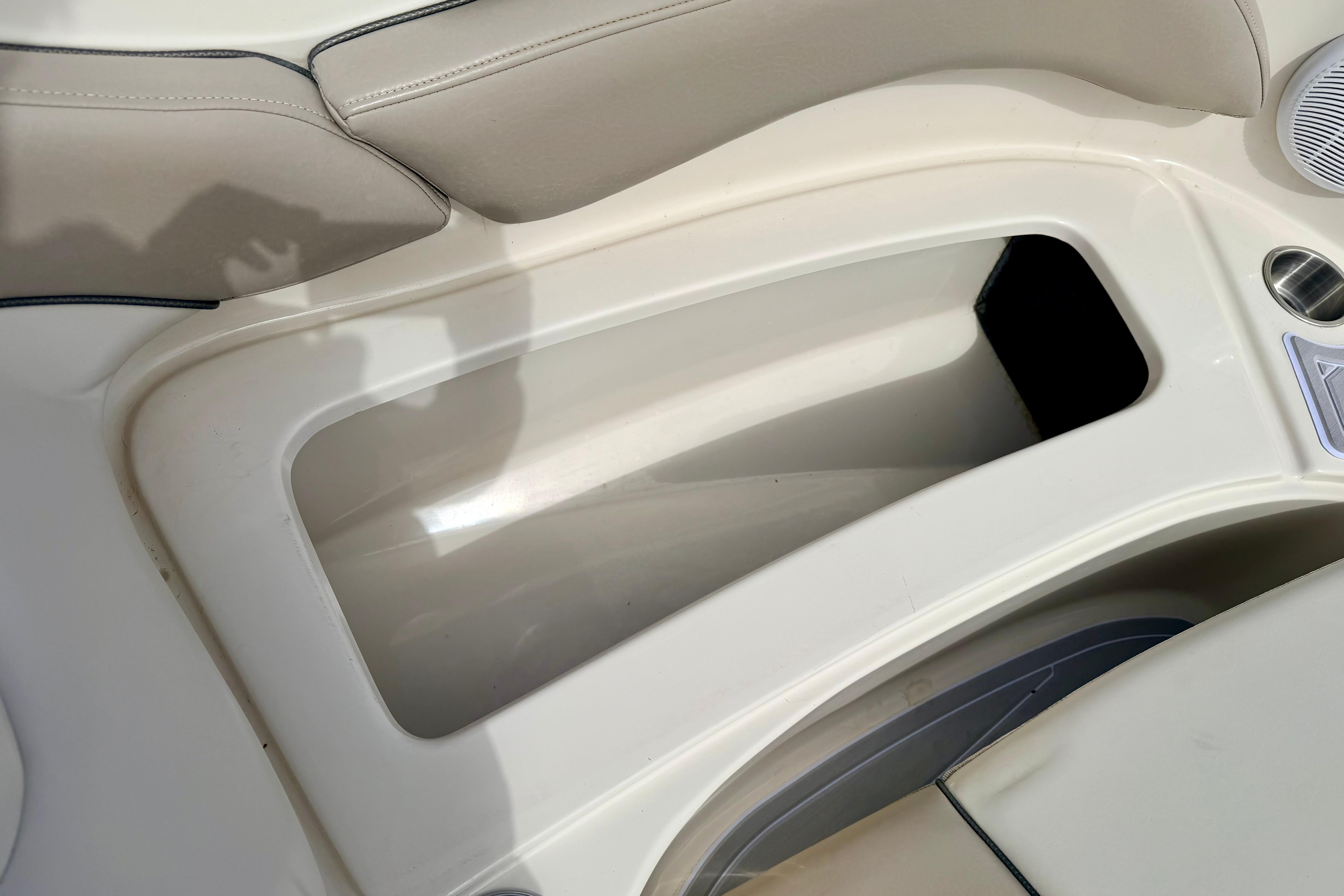 Interior storage compartment of a 2003 Sea Ray 200 Sundeck boat.