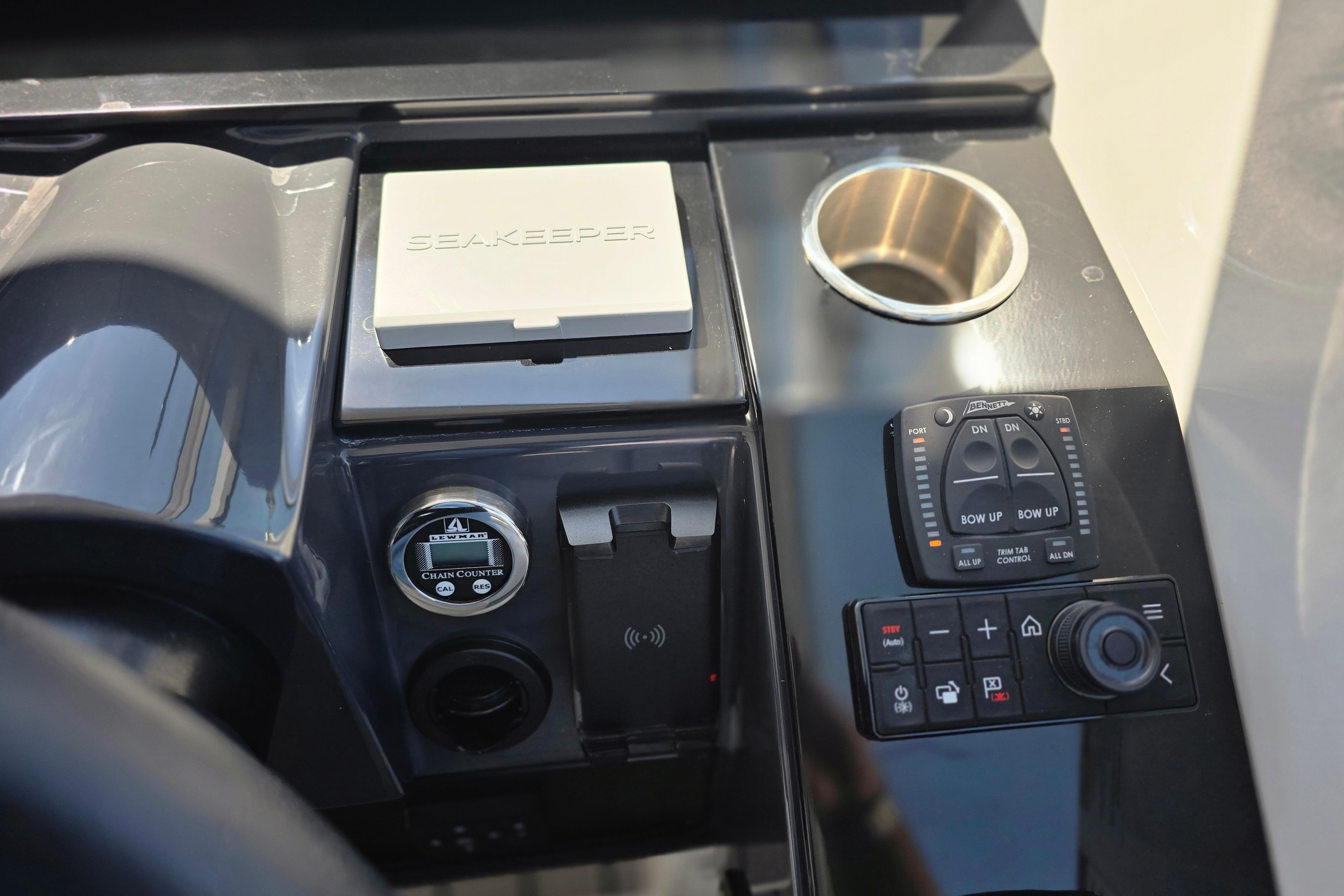 Control panel of 2025 Formula 380 Super Sport Crossover OB with Seakeeper and cup holder.