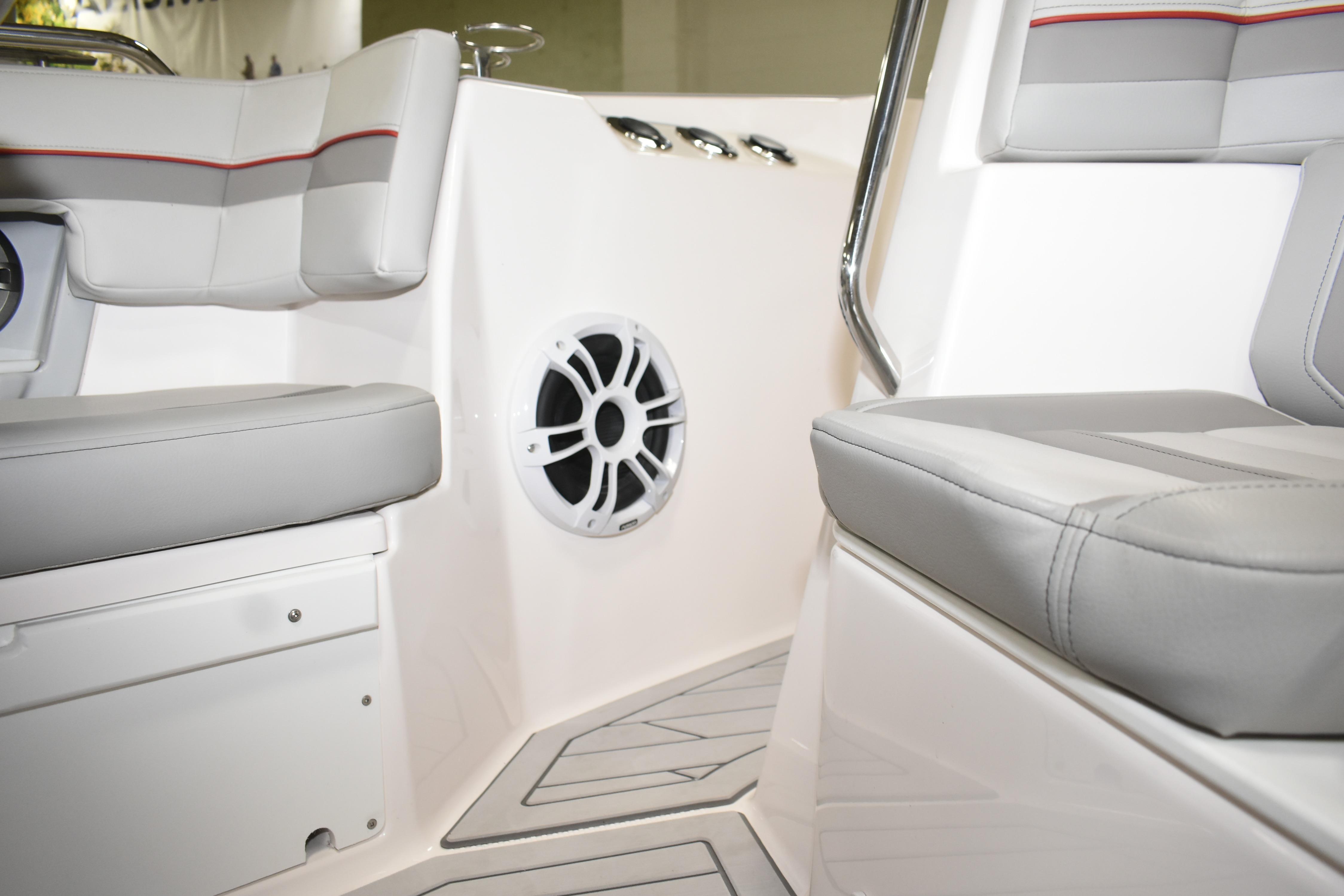 Interior of 2025 Solara S-310 CW boat with gray seating and speaker system.
