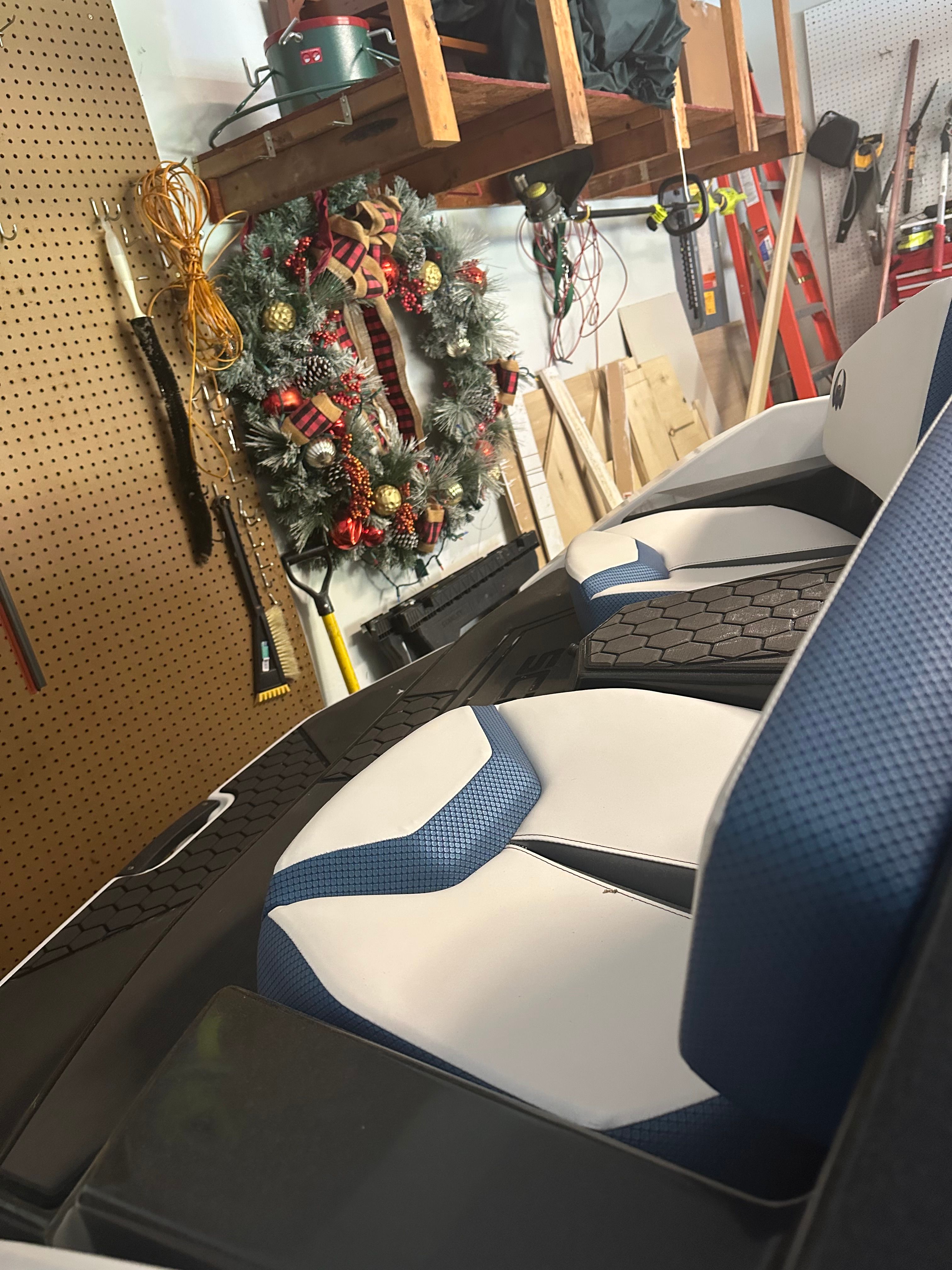 2023 Scarab Identity Jet in storage with Christmas wreath.