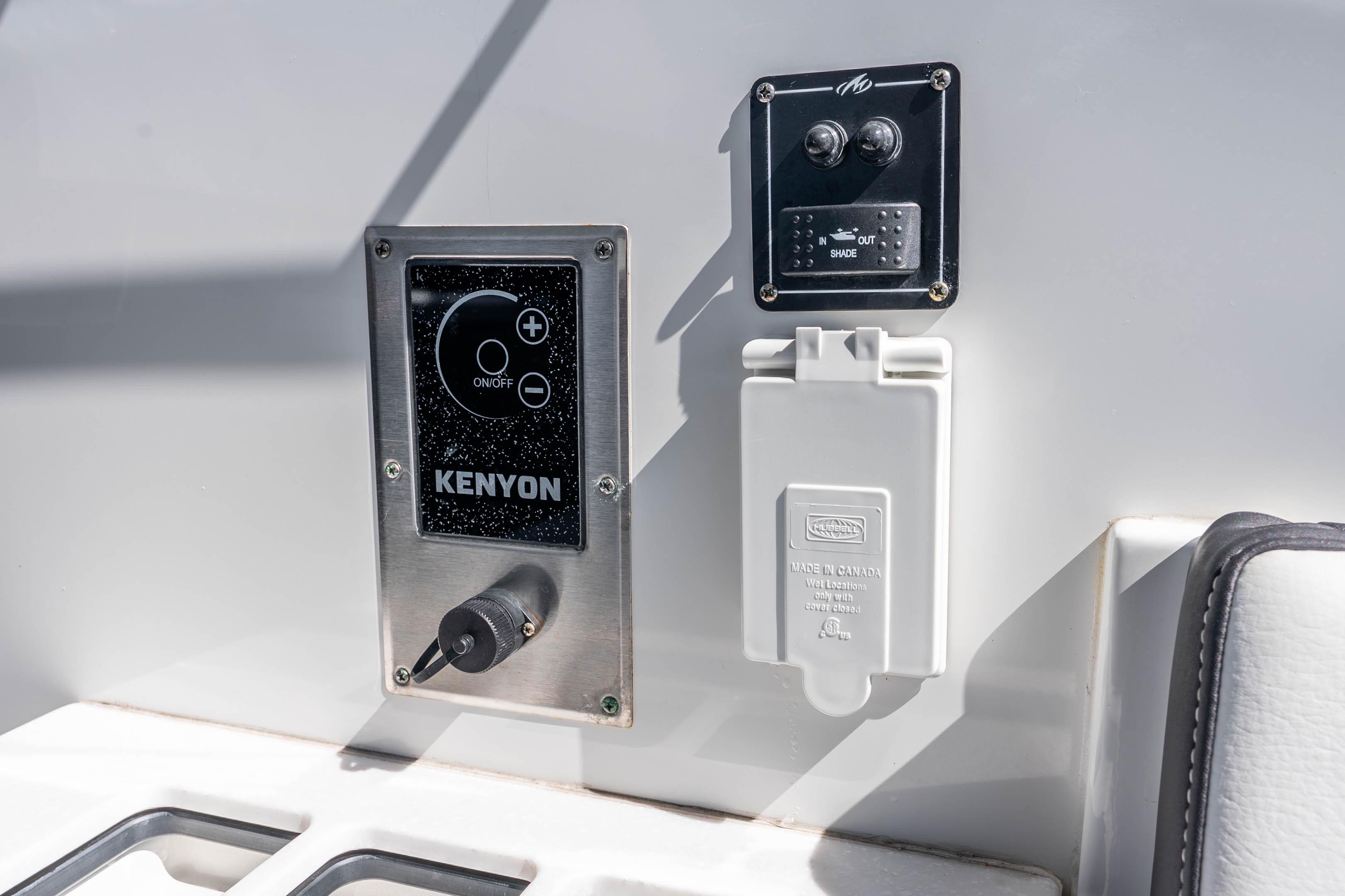 Control panel on 2022 Monterey 378SS Super Sport boat, featuring Kenyon system and shade switch.
