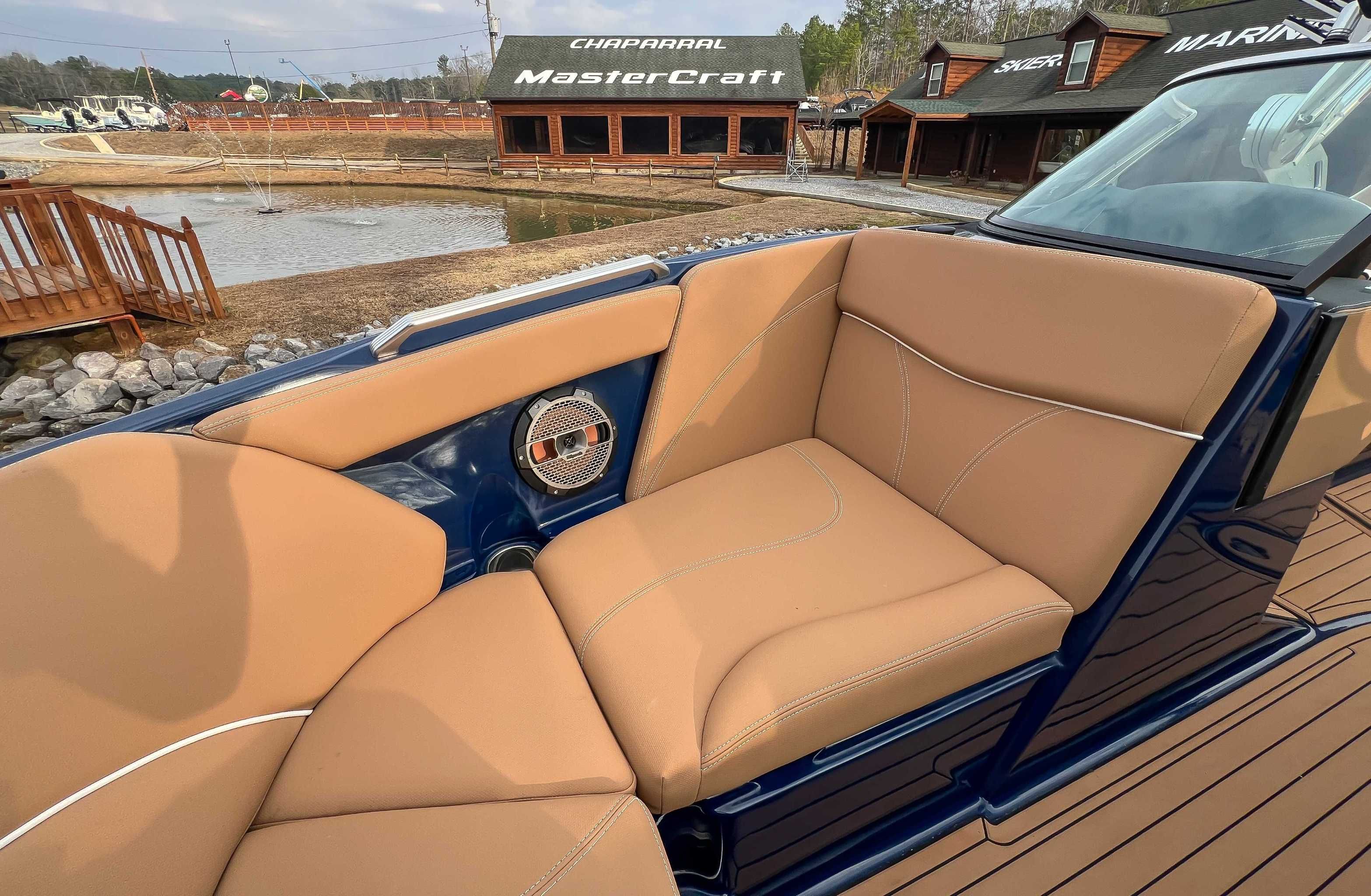 2021 MasterCraft XT22 boat with beige seats and speaker.