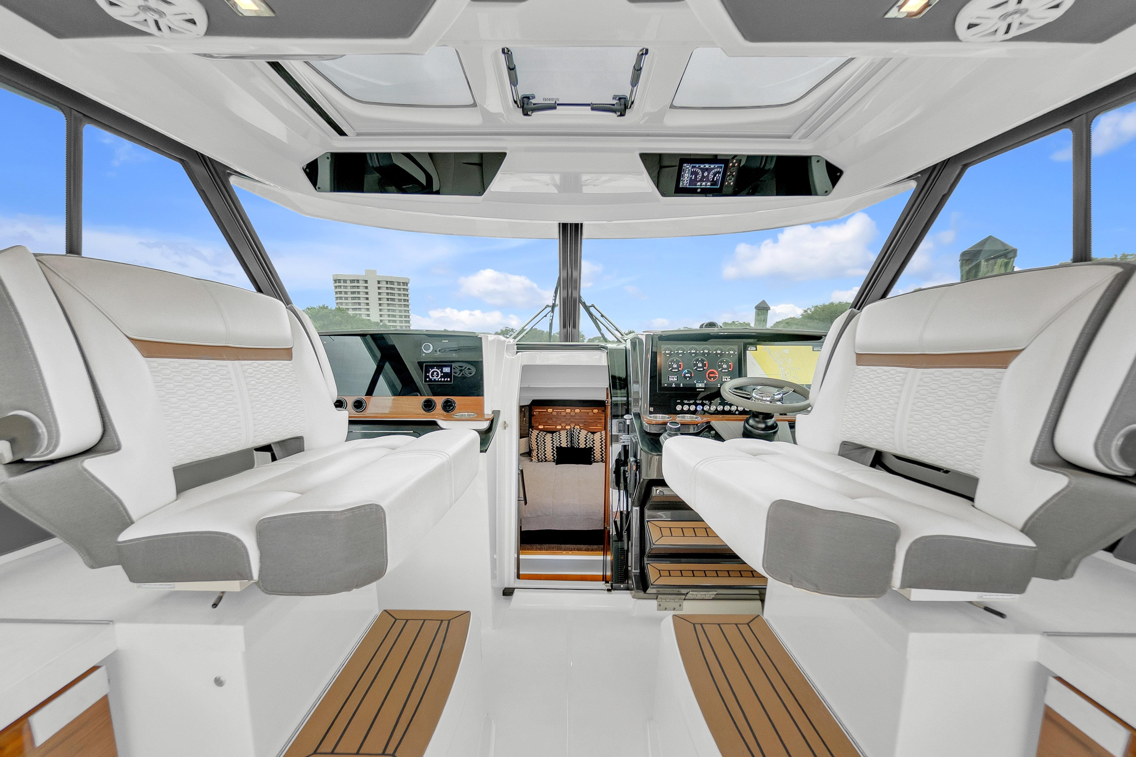 Interior of 2021 Tiara Sport 43 LE yacht with modern helm and seating.