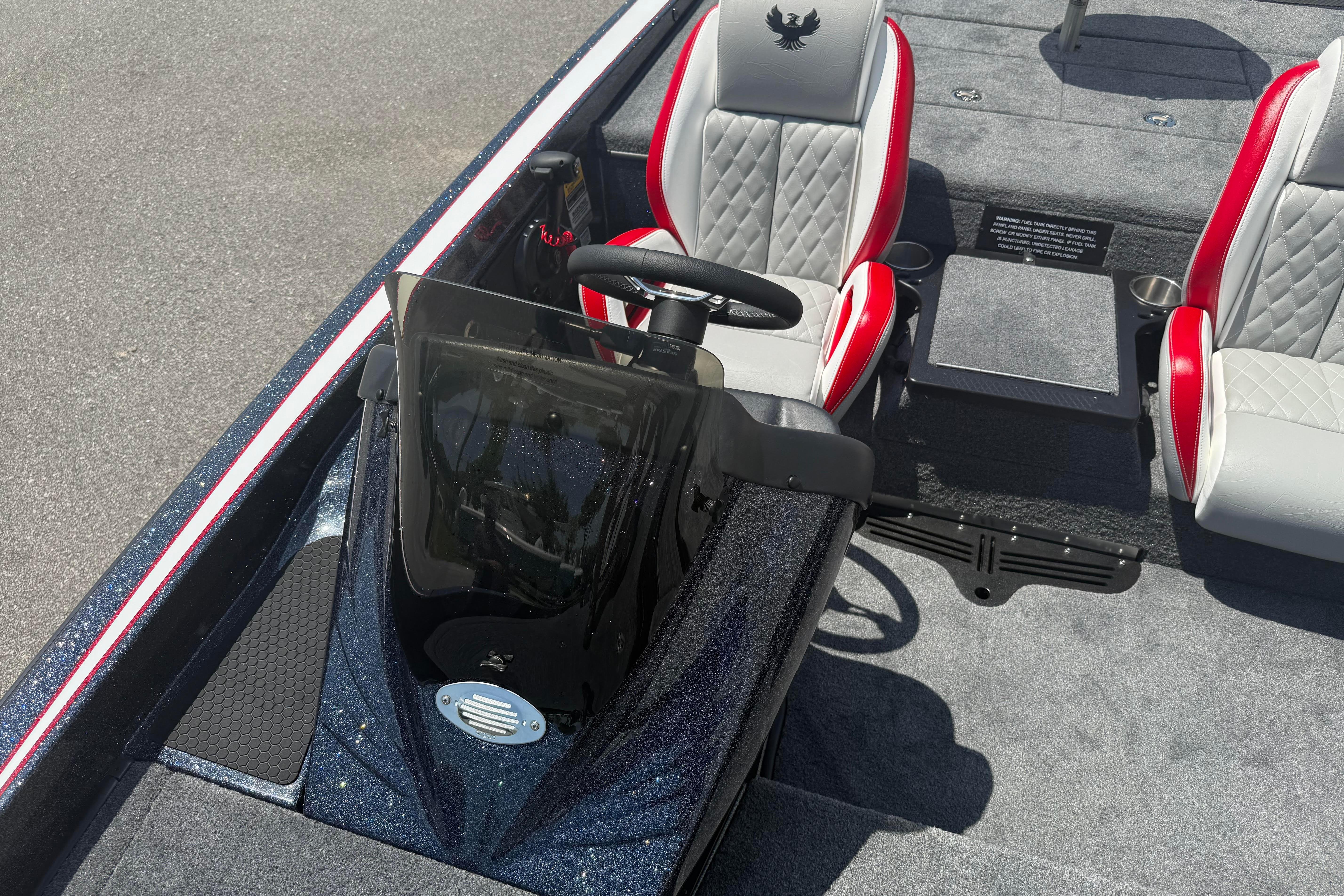 2027 Phoenix 819 ZXL boat interior with dual seats and steering console.